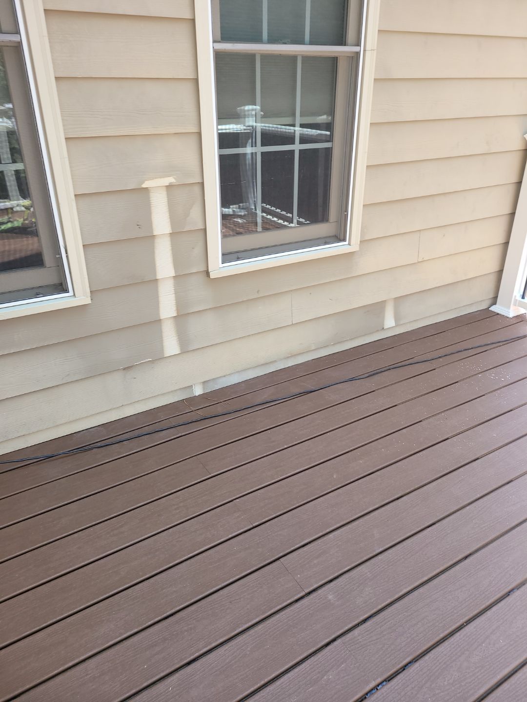 Fuquay-Varina Outdoor Upgrade – Composite Deck & Paved Landing by Elite Remodeling and Design LLC