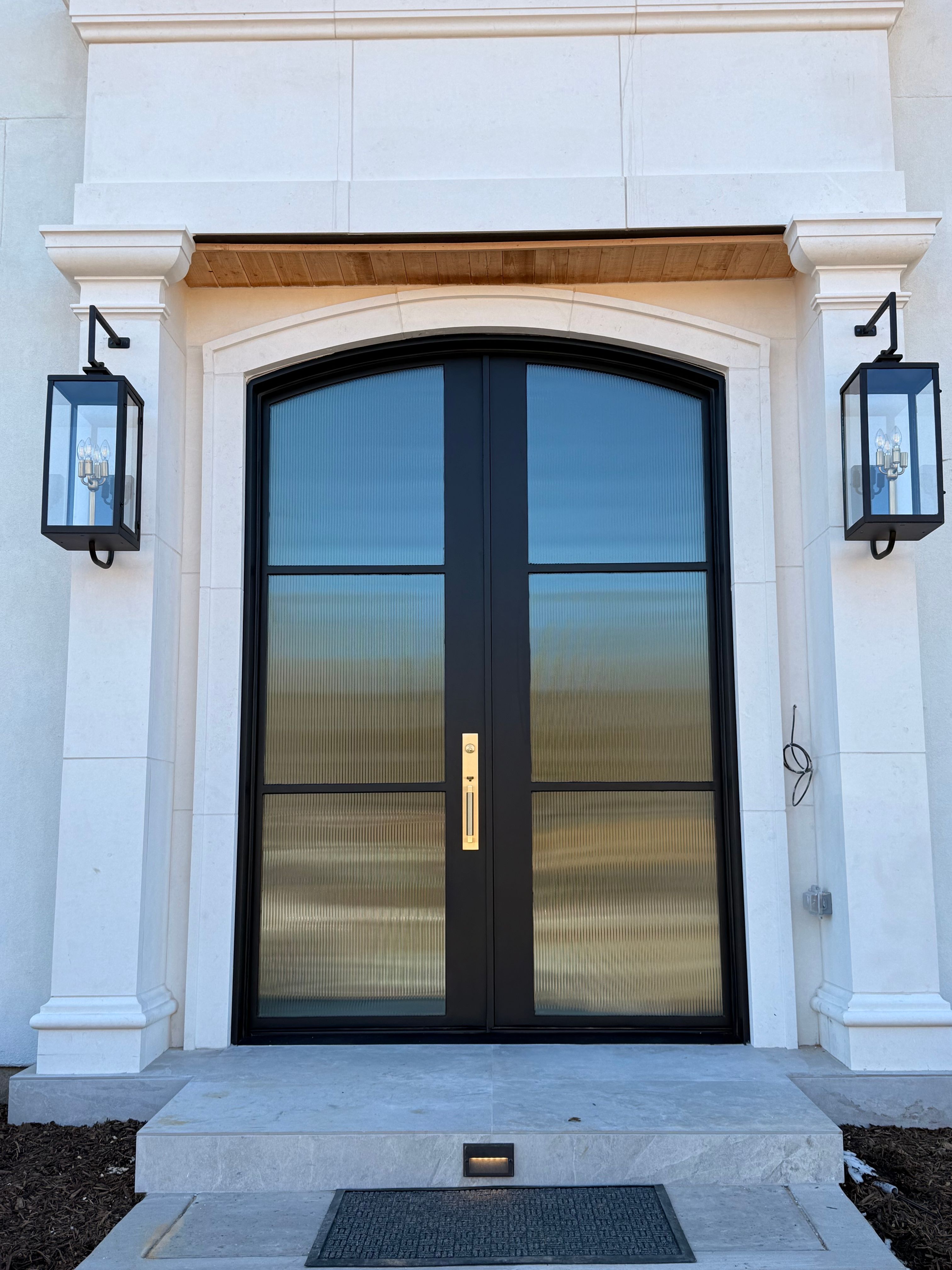 Custom Arched Entry Door Installation and Finishing in Southlake by Solara Custom Living