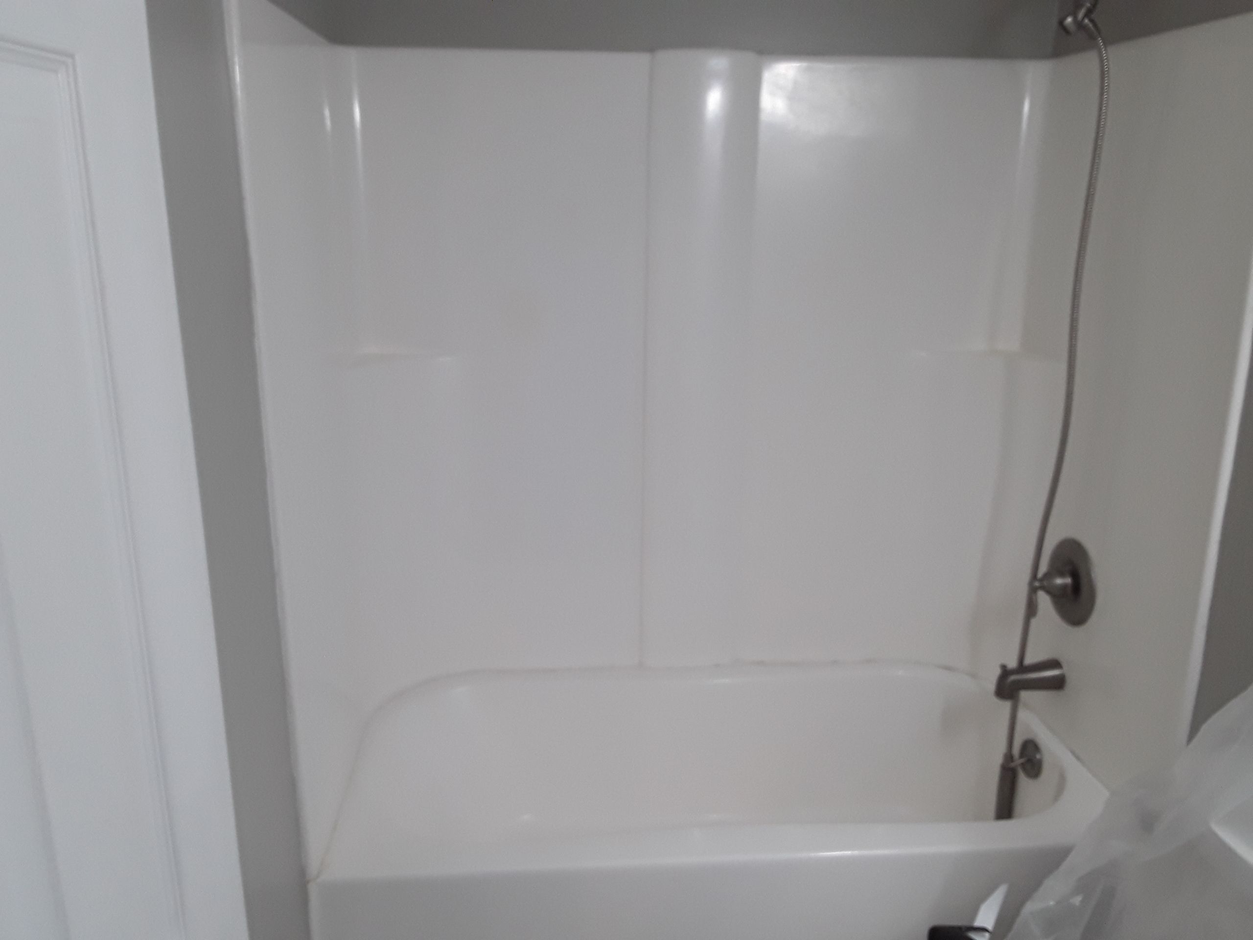 Tub to Shower Conversion using BCI Acrylic Shower System by Secure Construction Company Inc