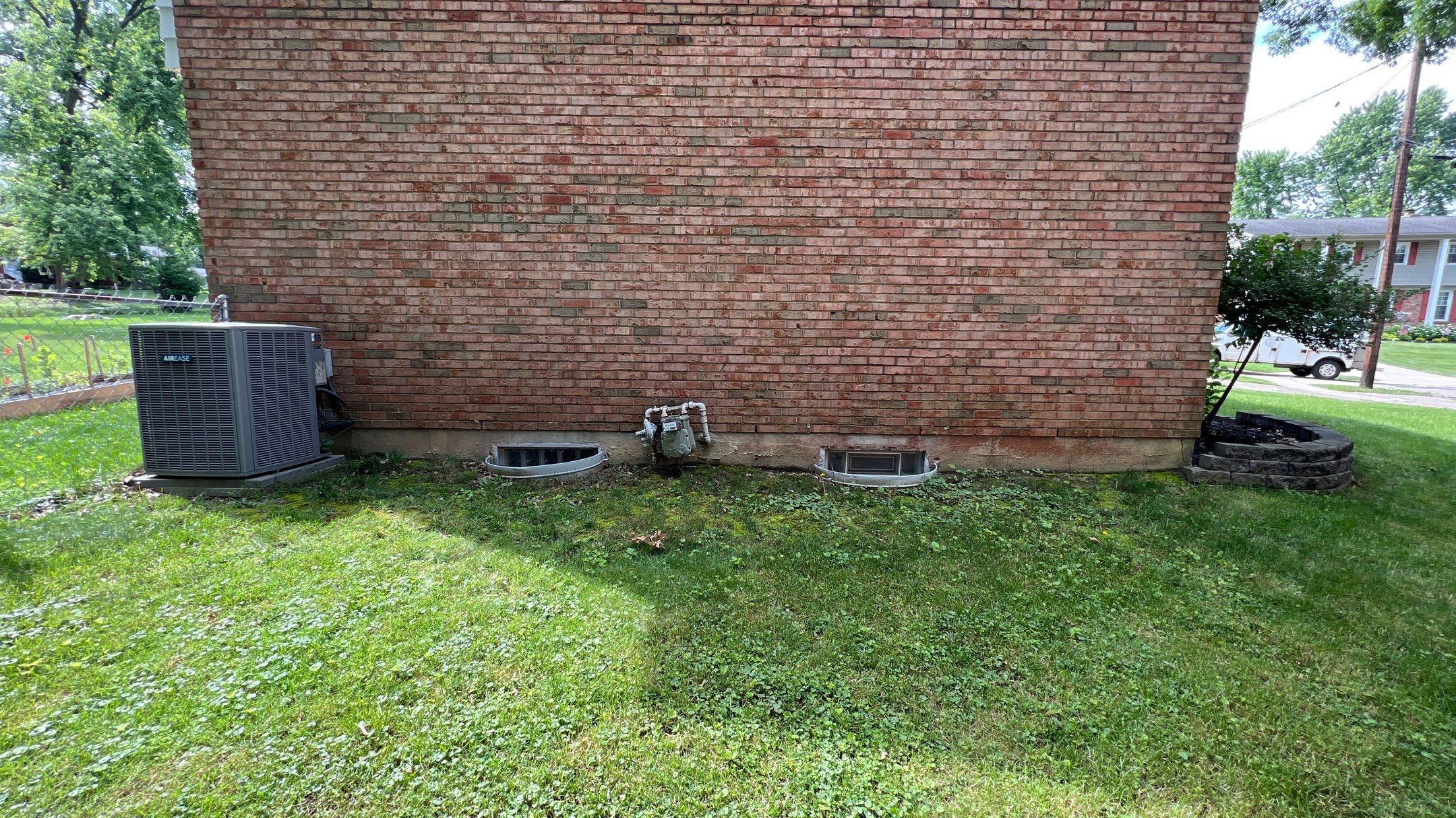 French Drain Install with Oversized River Gravel and Steel Metal Edging by Reisenberg’s Lawn & Landscape, LLC