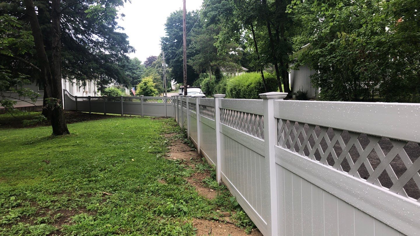Vinyl Privacy Fence with Lattice top, matching gate in White by DiGiorgi Roofing and Siding Inc
