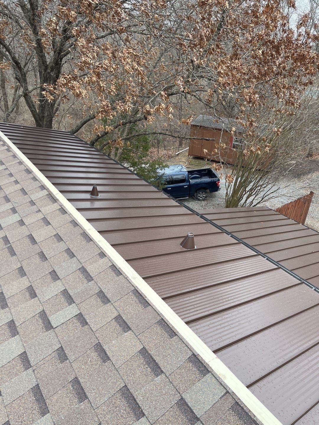 Residential Roofing Installation using Standing Seam Metal Roofing and Composition Shingles by Rainy Day Restoration