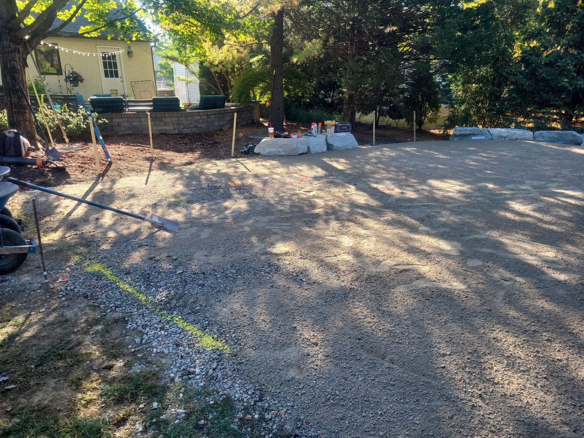 Custom Backyard Putting Green around Landscape Boulders in Hilliard by Southwest Greens Midwest