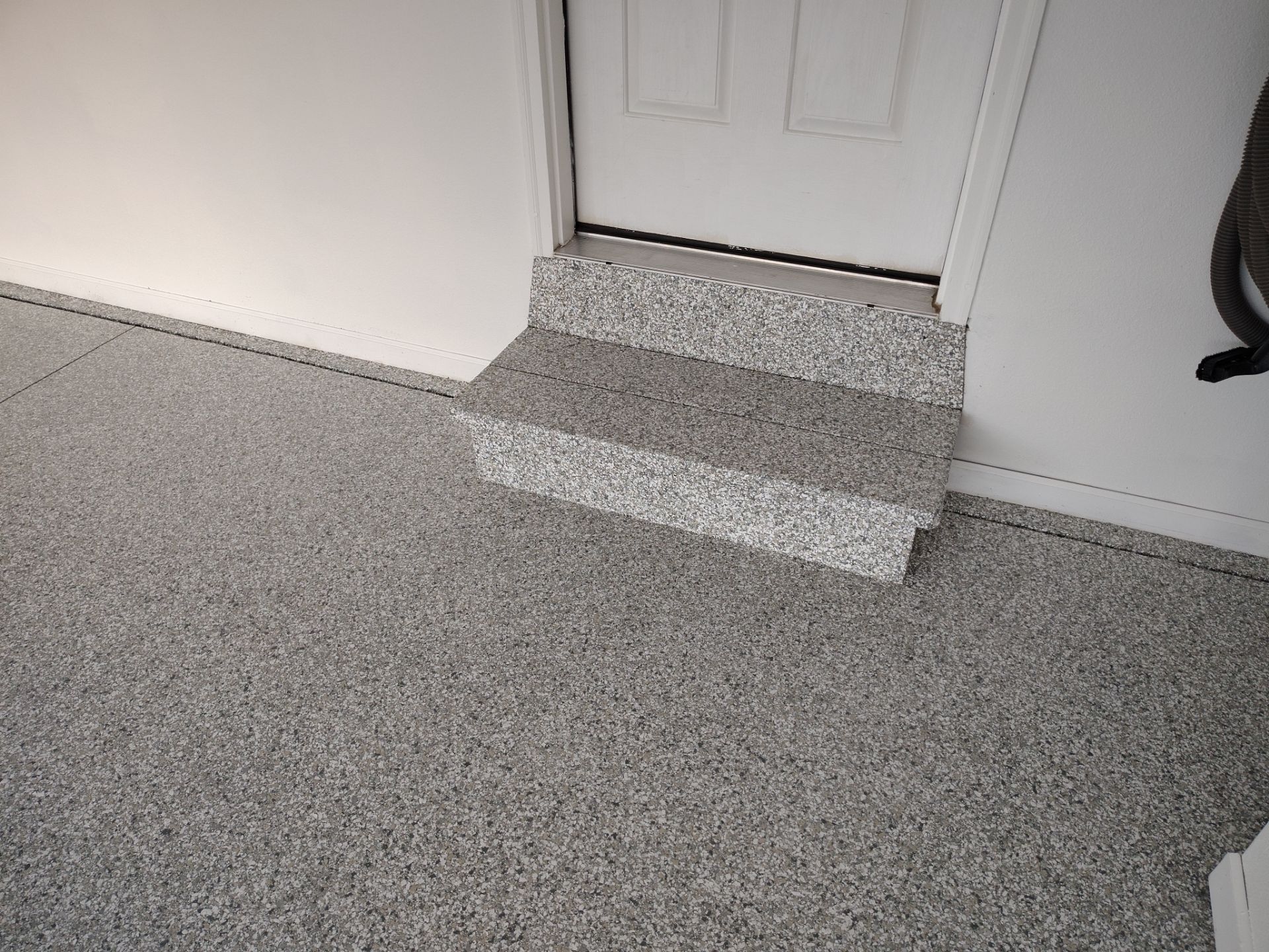 New Johnston Garage Resurfacing by Revival Concrete Coatings, LLC