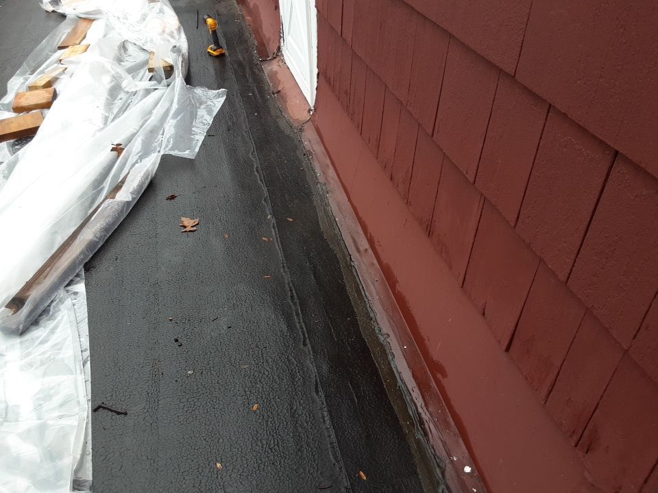 Residential Roof Replacement using Patio Roof by Absolute Roofing and Construction