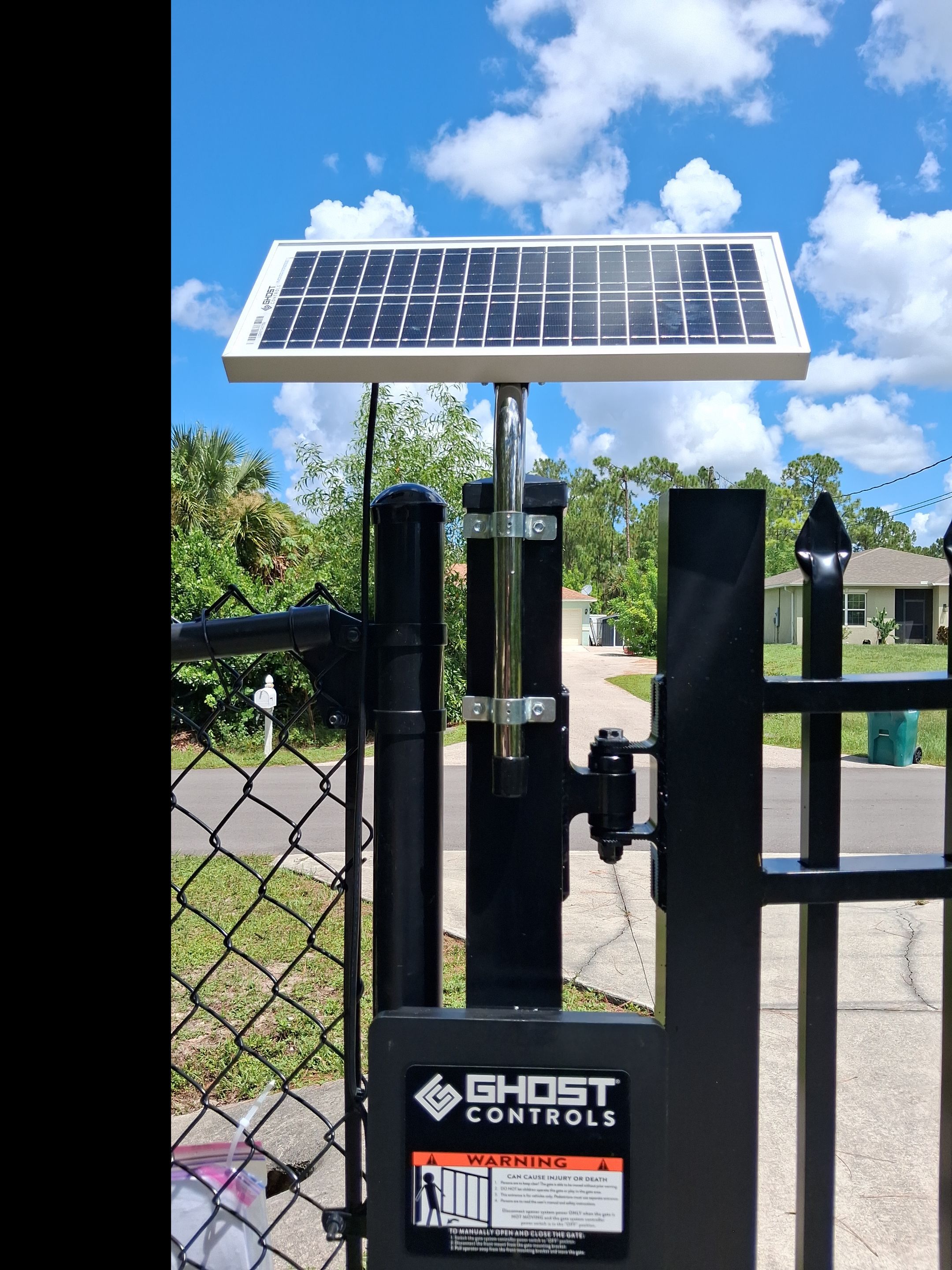 Automated Driveway Gate and Black Chain Link Fence Installation by True Fence LLC