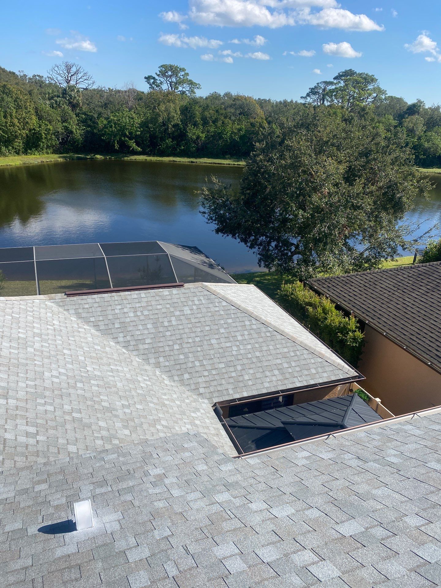 Merritt Island Roof Replacement for Two-Story Home Using Architectural Shingles by Wiedmann Construction & Roofing