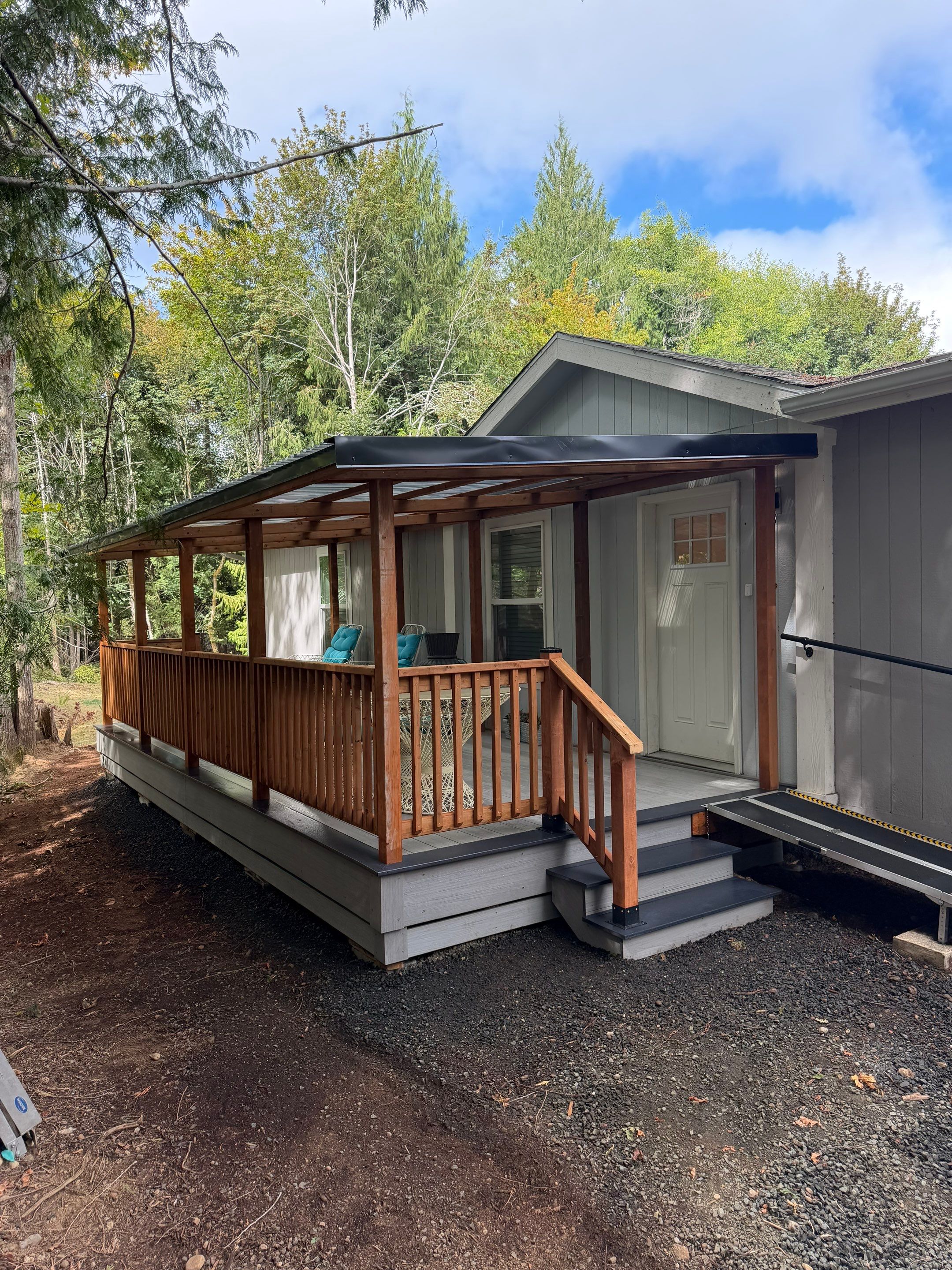 Covered Composite Deck with Translucent Pergola Roof in Port Orchard by Expedeck