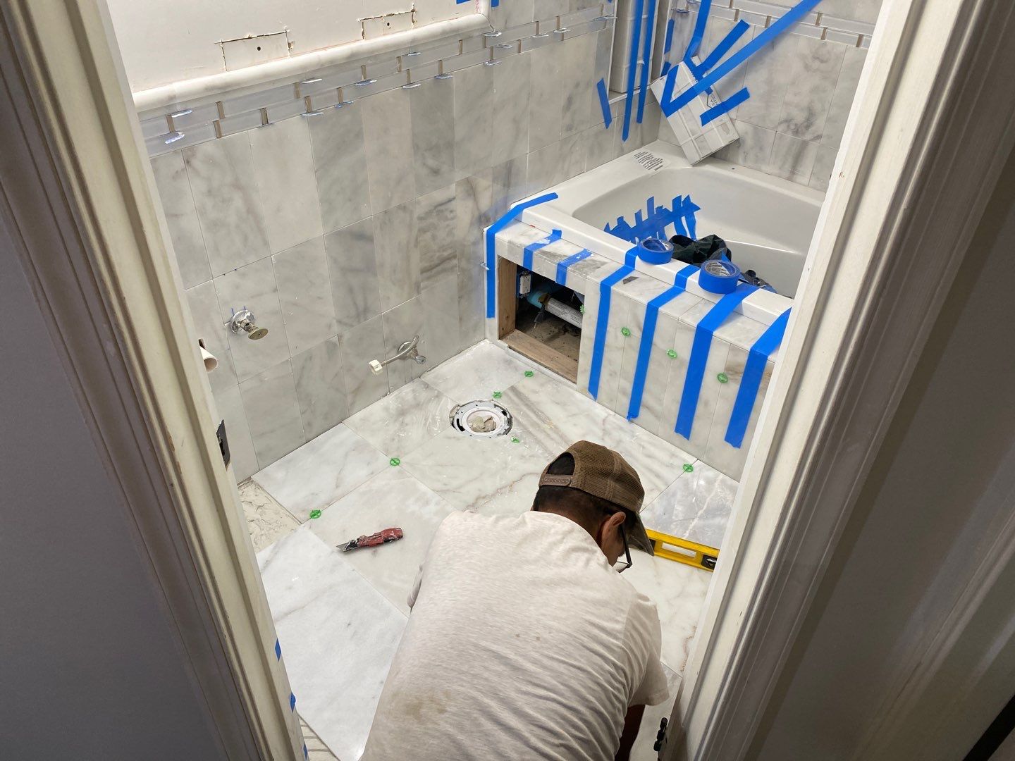 Bathroom Remodel using Two new bathroom design and new floors by Alpha Design Services