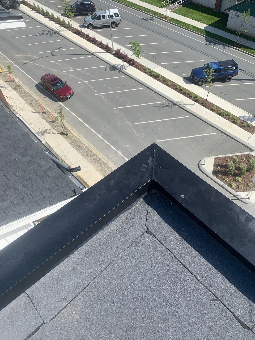 Large apartment with sbs, shingles and prolok metal  by Top Notch Roofing Inc