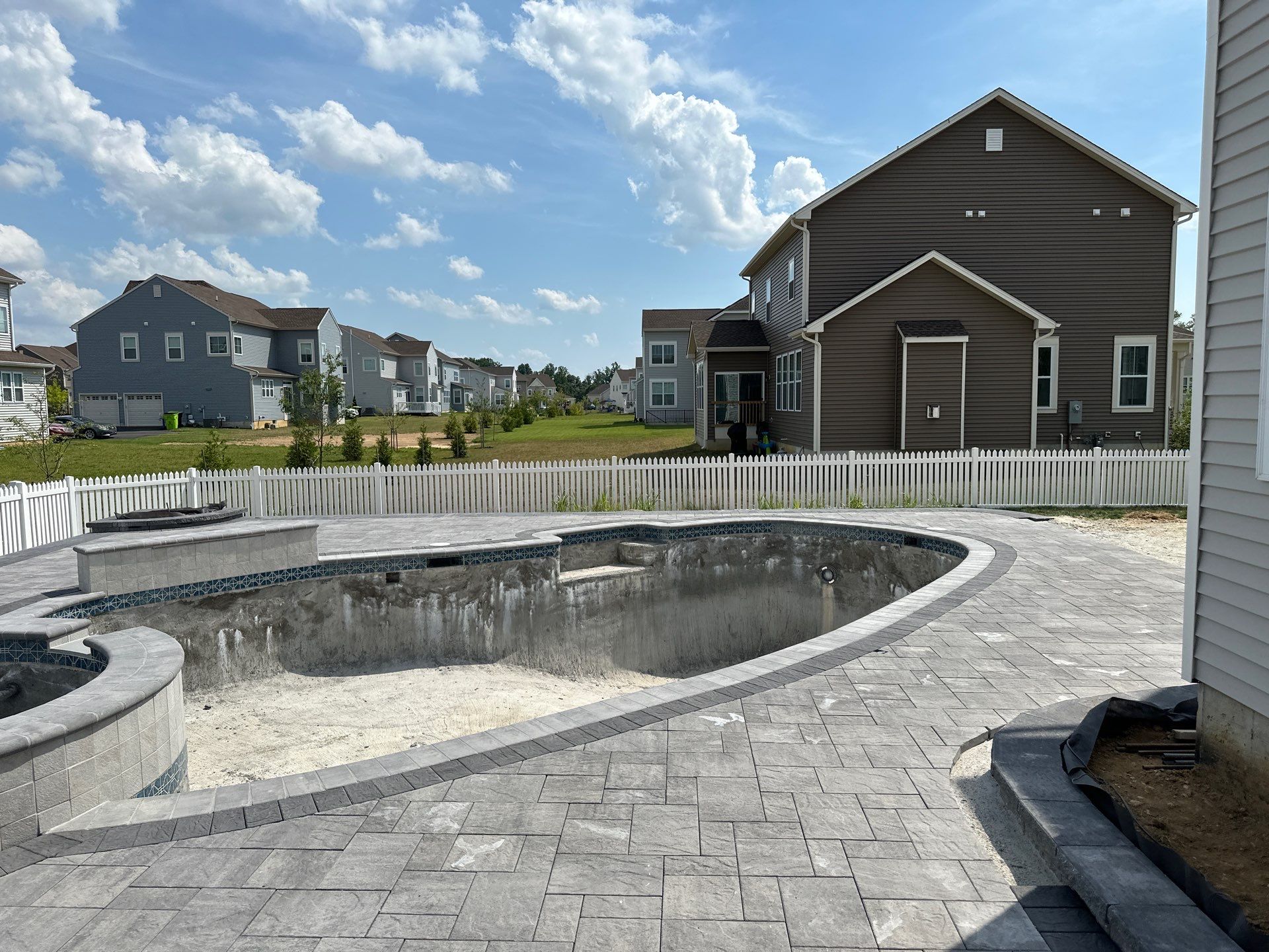 Pool and Hardscape Design in Delaware | Belgard Paver Patio & Outdoor Living Space by Studio G Indoor Spaces & Outdoor Living