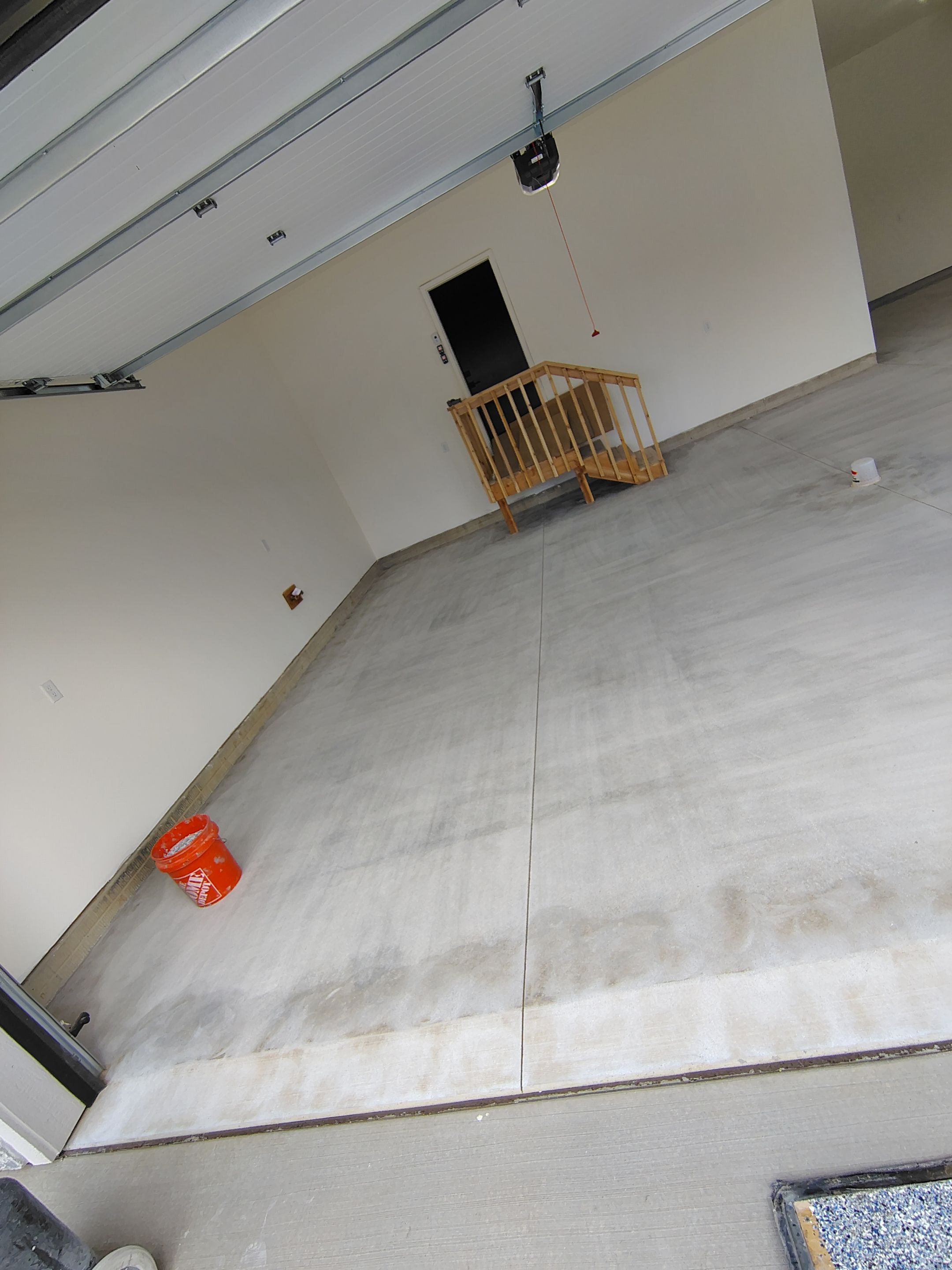 Sioux Falls Garage Floor Transformation with Gray Decorative Flake Coating by Select Painting, Coatings & Garage Cabinets