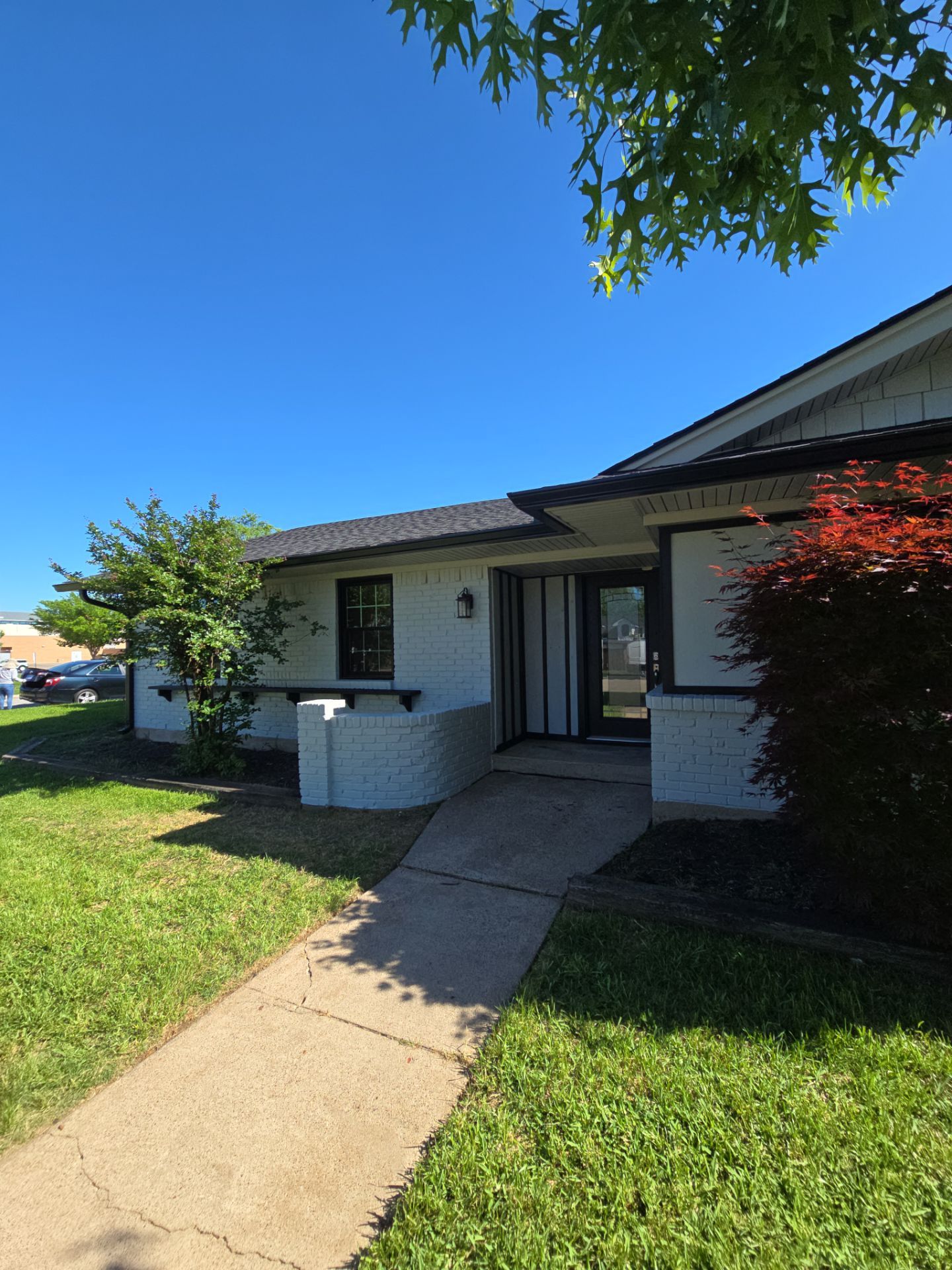 Exterior Home Paint Project with Different Surfaces by SLM General Contractors & Roofing