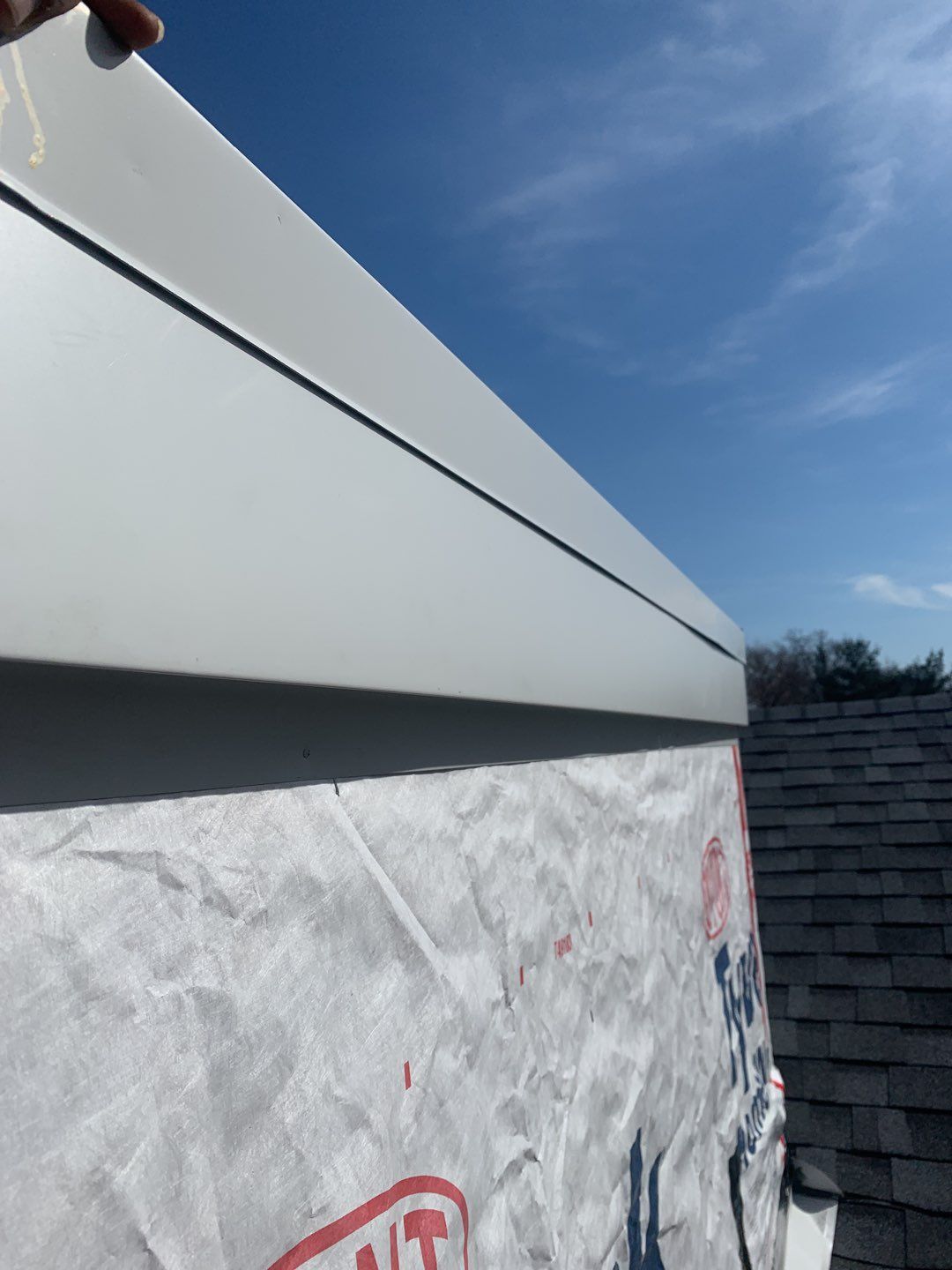 Commercial Roofing Installation using EPDM with white gutters by A Plus Exterior