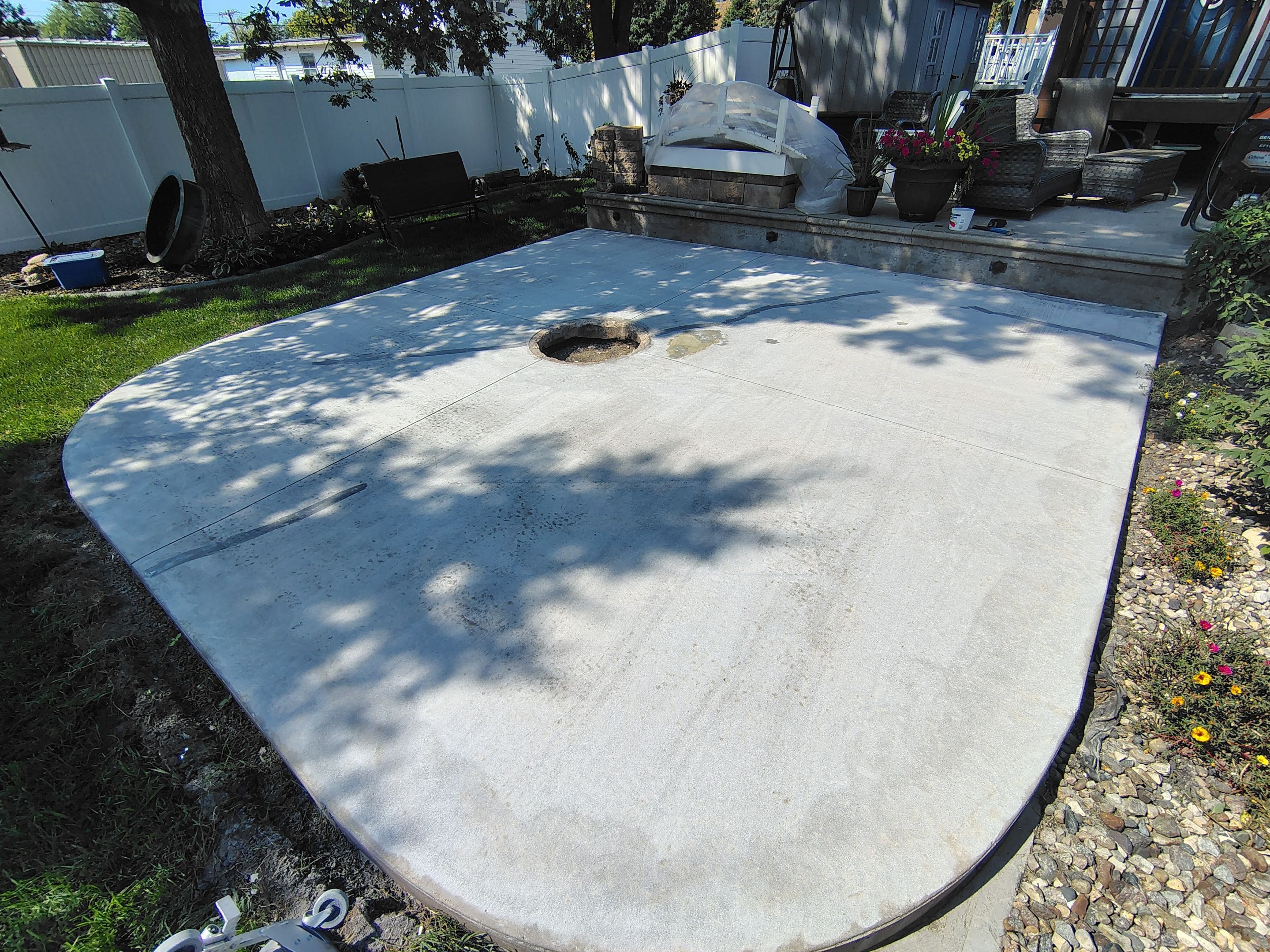 Custom Garage Floor Coating and Backyard Patio Refinishing in Tyndall by Select Painting, Coatings & Garage Cabinets