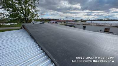 Residential Roofing Installation using 60 mil rubber roof 