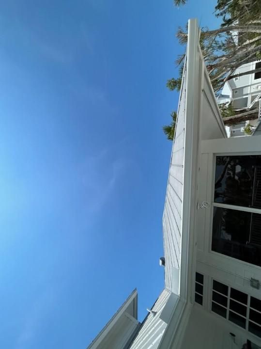 White Gutter Installation in Sanibel FL by Gutter Professors