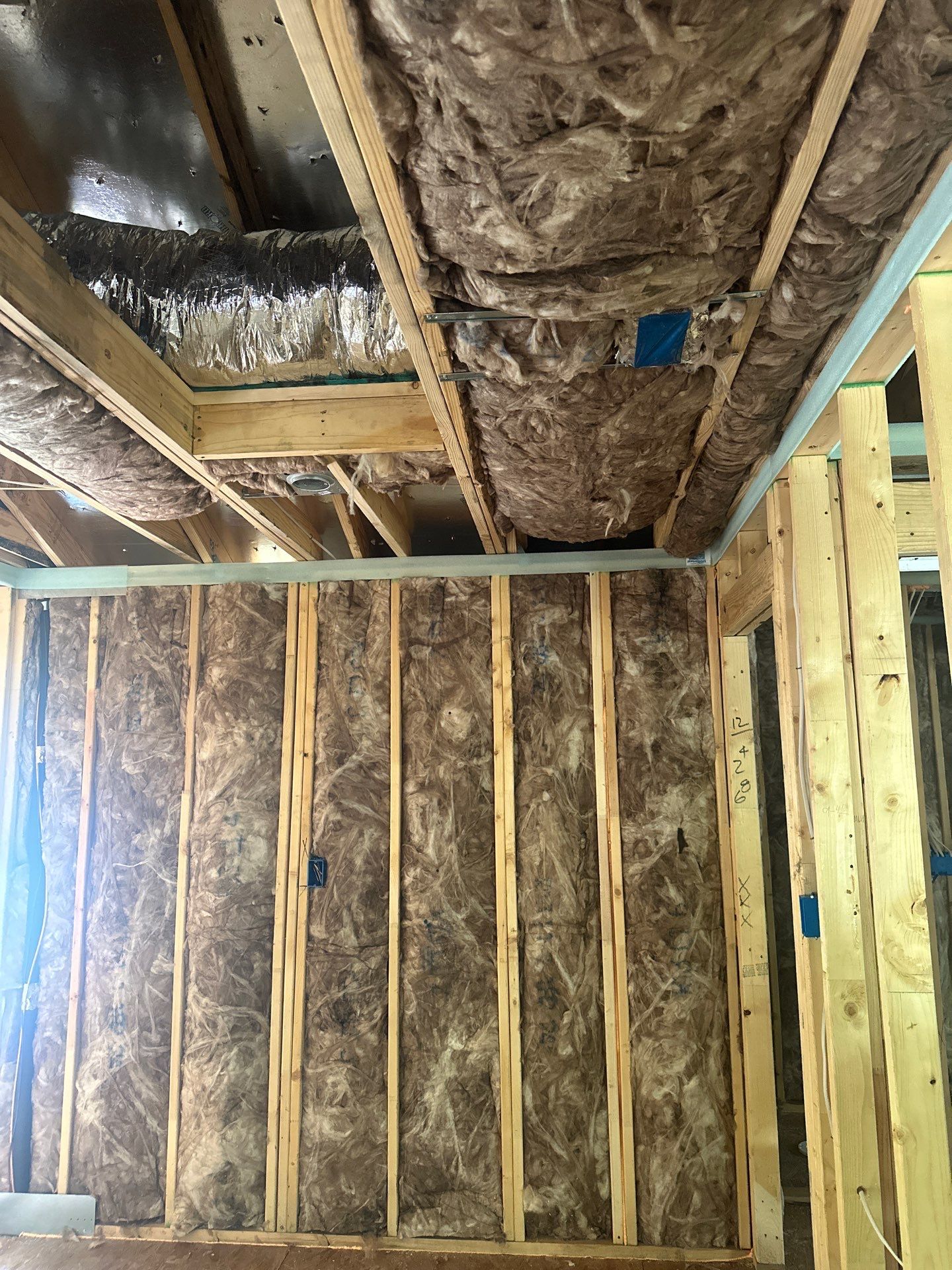 Fiberglass batt install on a second story addition in Dallas by Apex Insulation Solutions