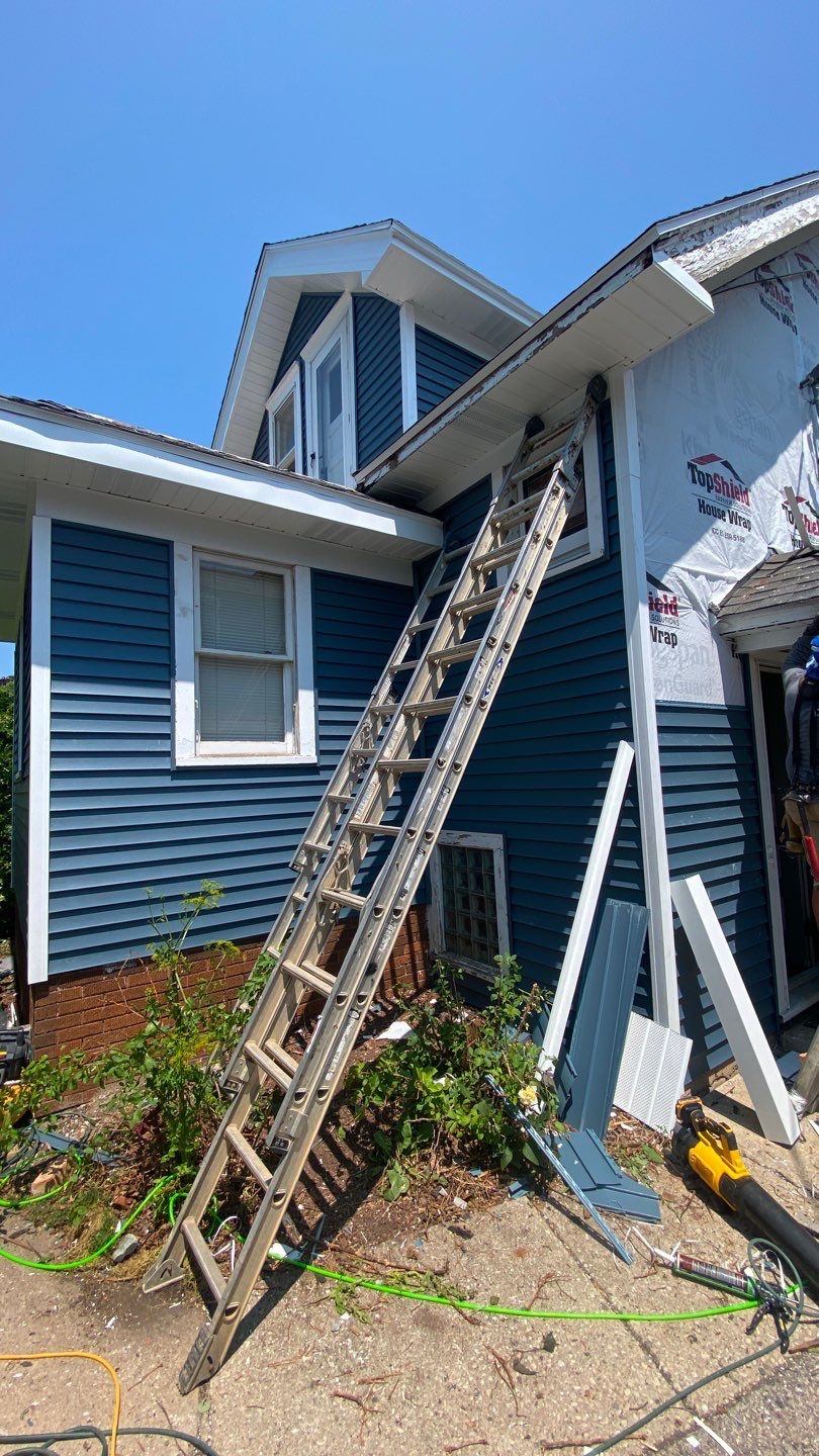 Asphalt Roof, Vinyl Siding, and Aluminum Gutter Replacement by Custom Installations