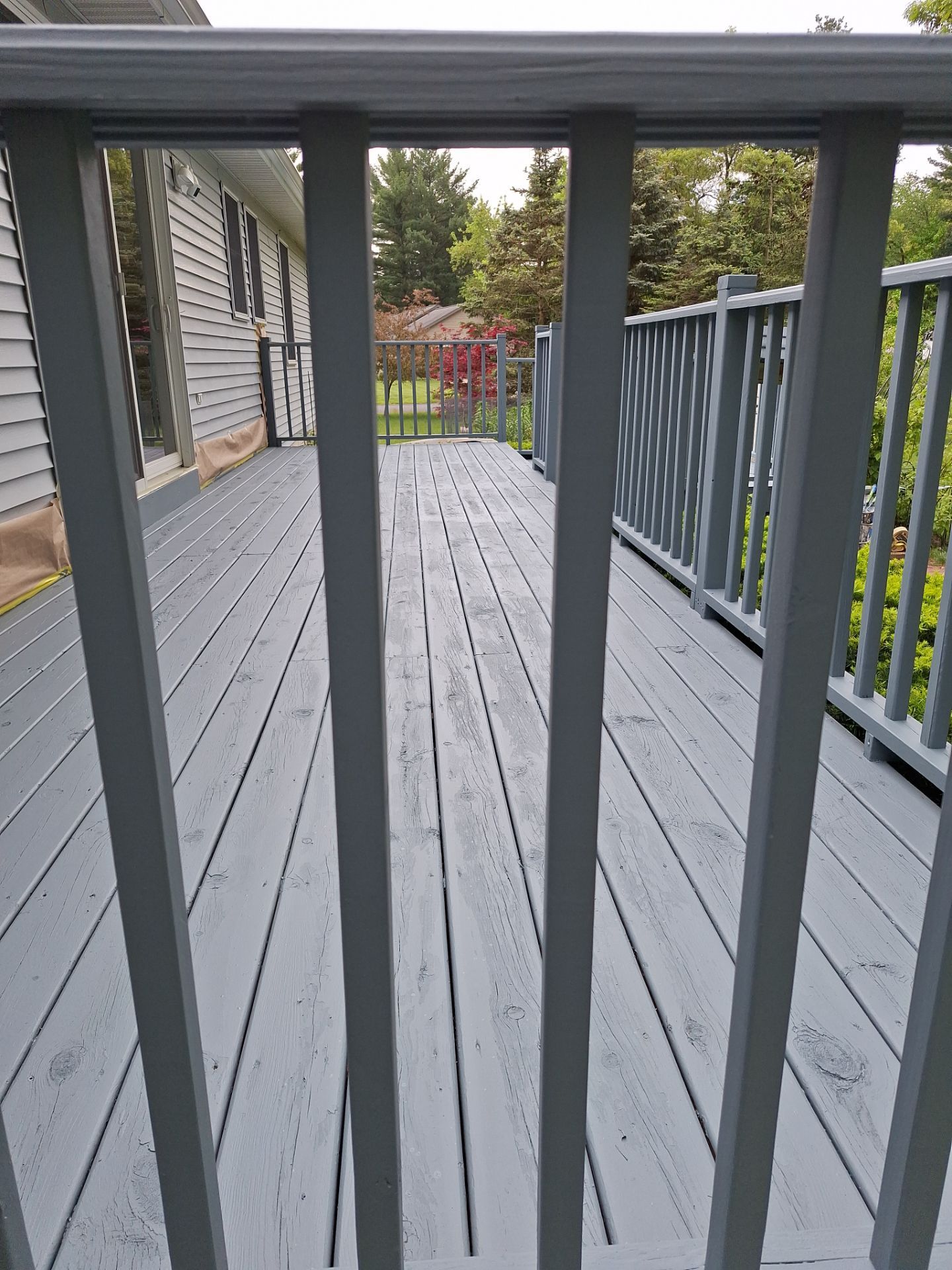 Repaint bedroom furniture, Pergola, and doors. Stain decking by Gordon Painting