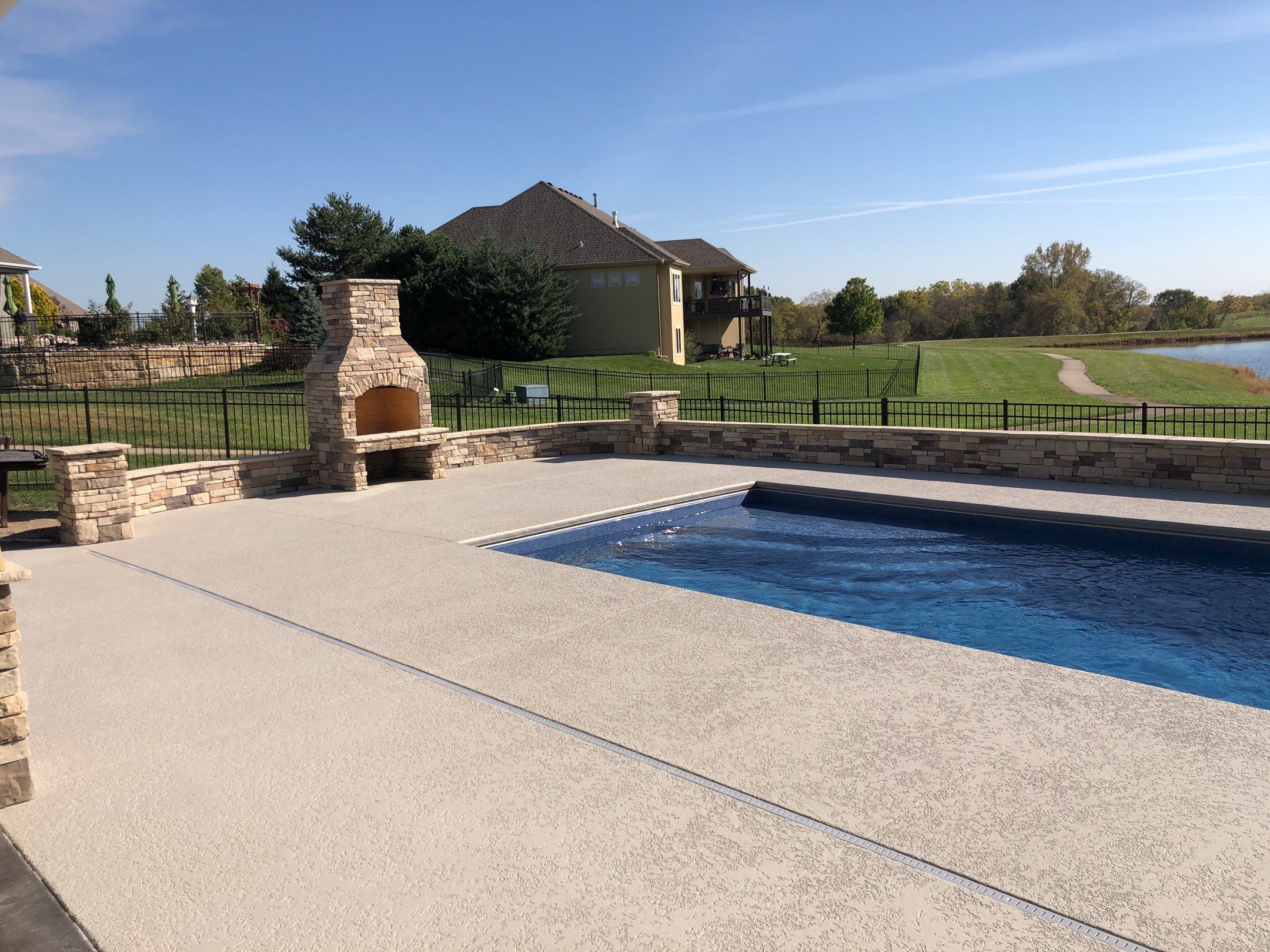 Parkville, MO -- Pool Deck Coating with Classic Texture (knockdown) finish by Big Red Decorative Concrete, LLC