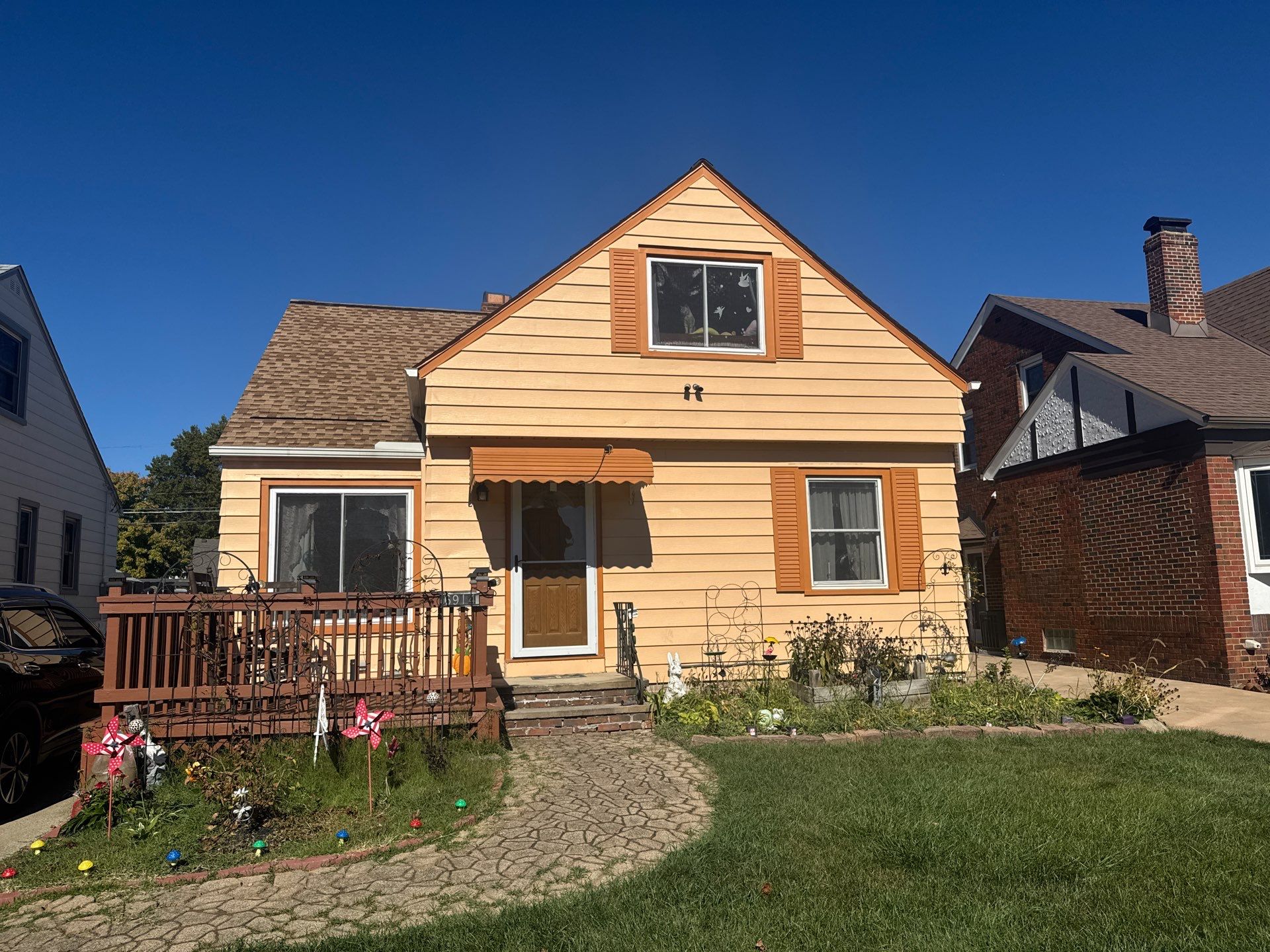 Full Exterior Siding and Awning Transformation in Parma by Cornerstone Roofing And Siding