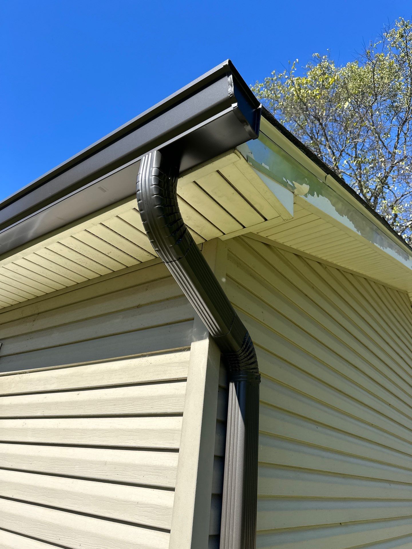 Roof and Gutter System Replacement with Stone Chimney Rebuild by Undersun Roofing 