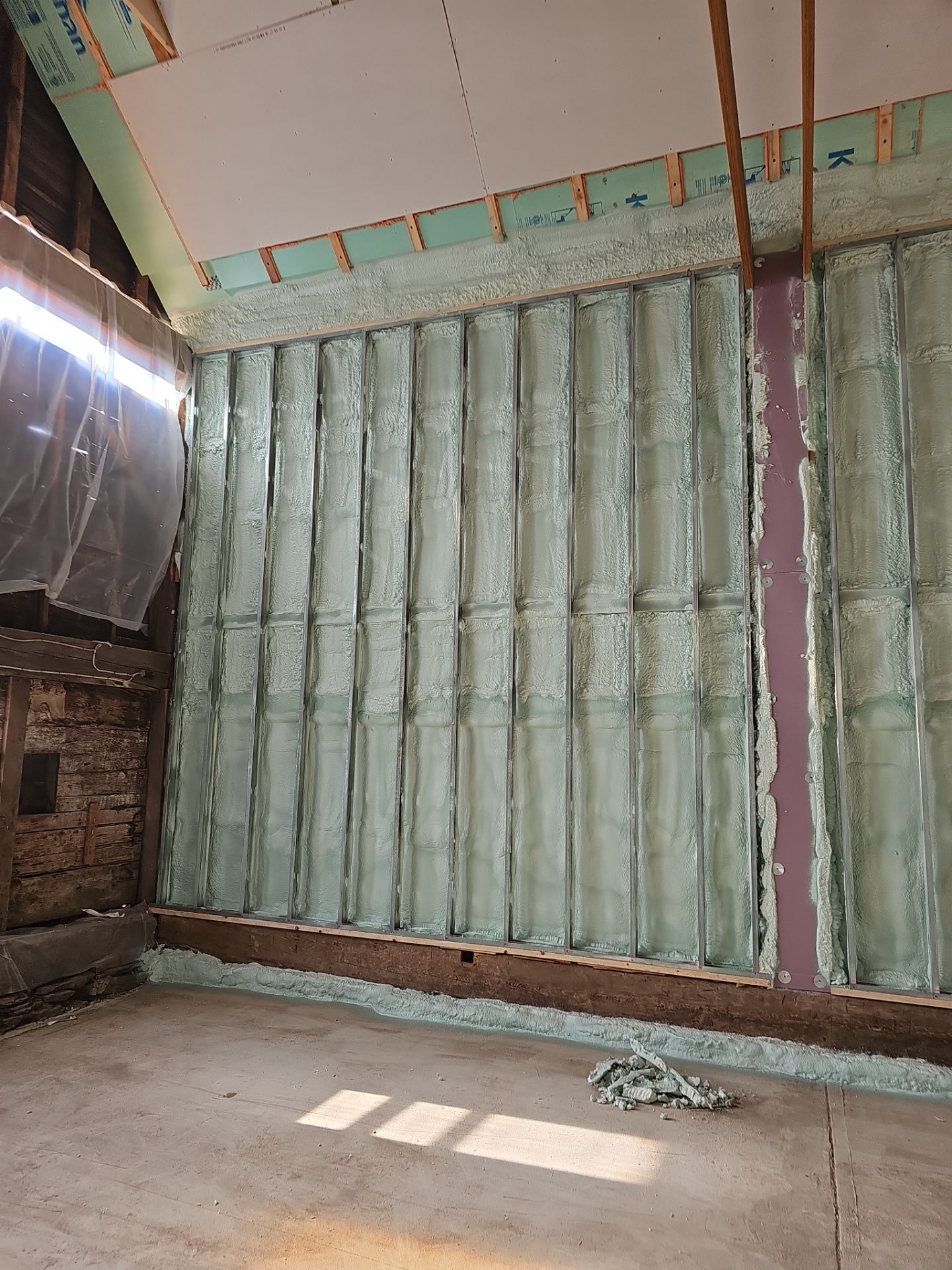 Exterior Installation using Closed Cell Spray Foam by NYS Foam & Energy