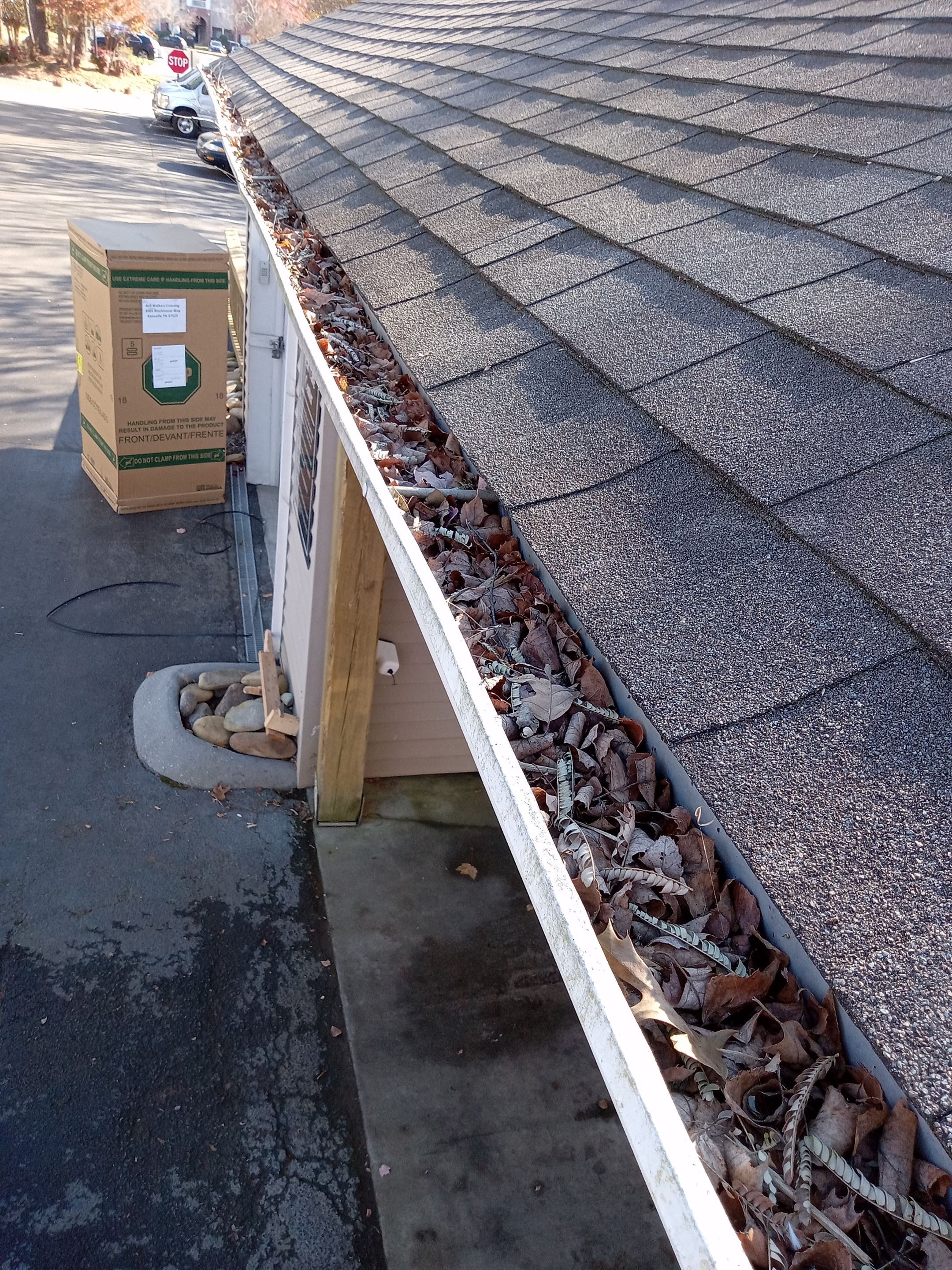 Commercial gutter cleaning Knoxville, TN before photo with filled gutters