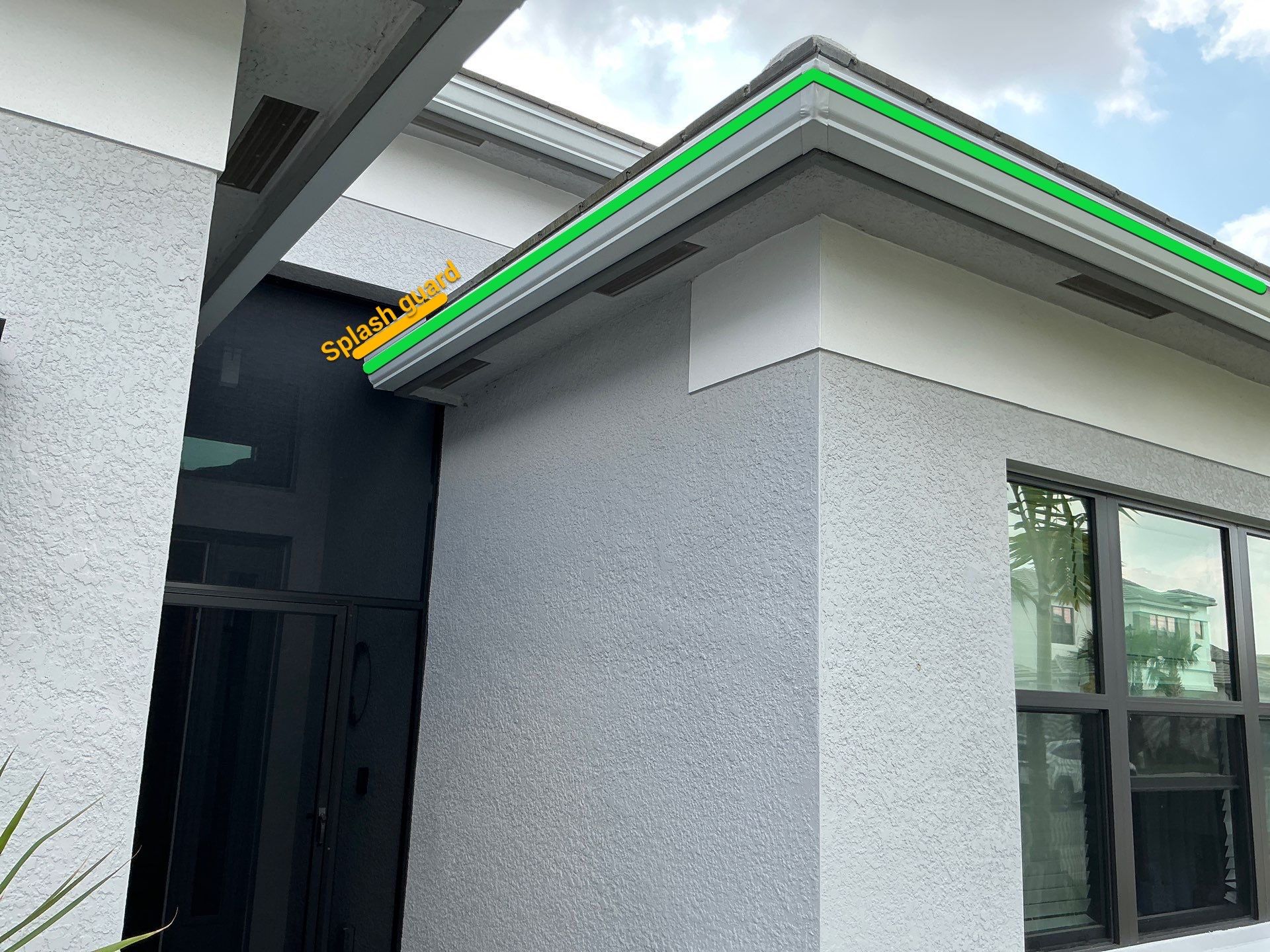 Grey Seamless Gutter Installation in Estero FL by Gutter Professors