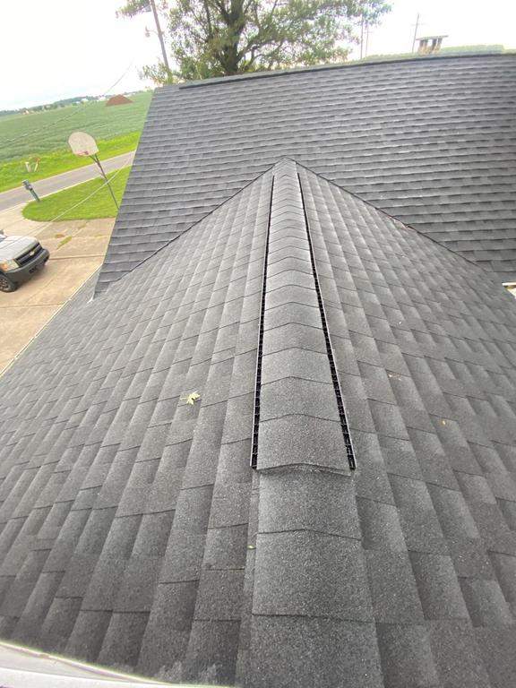 Storm damage roof replacement by Nitro Roofing and Construction