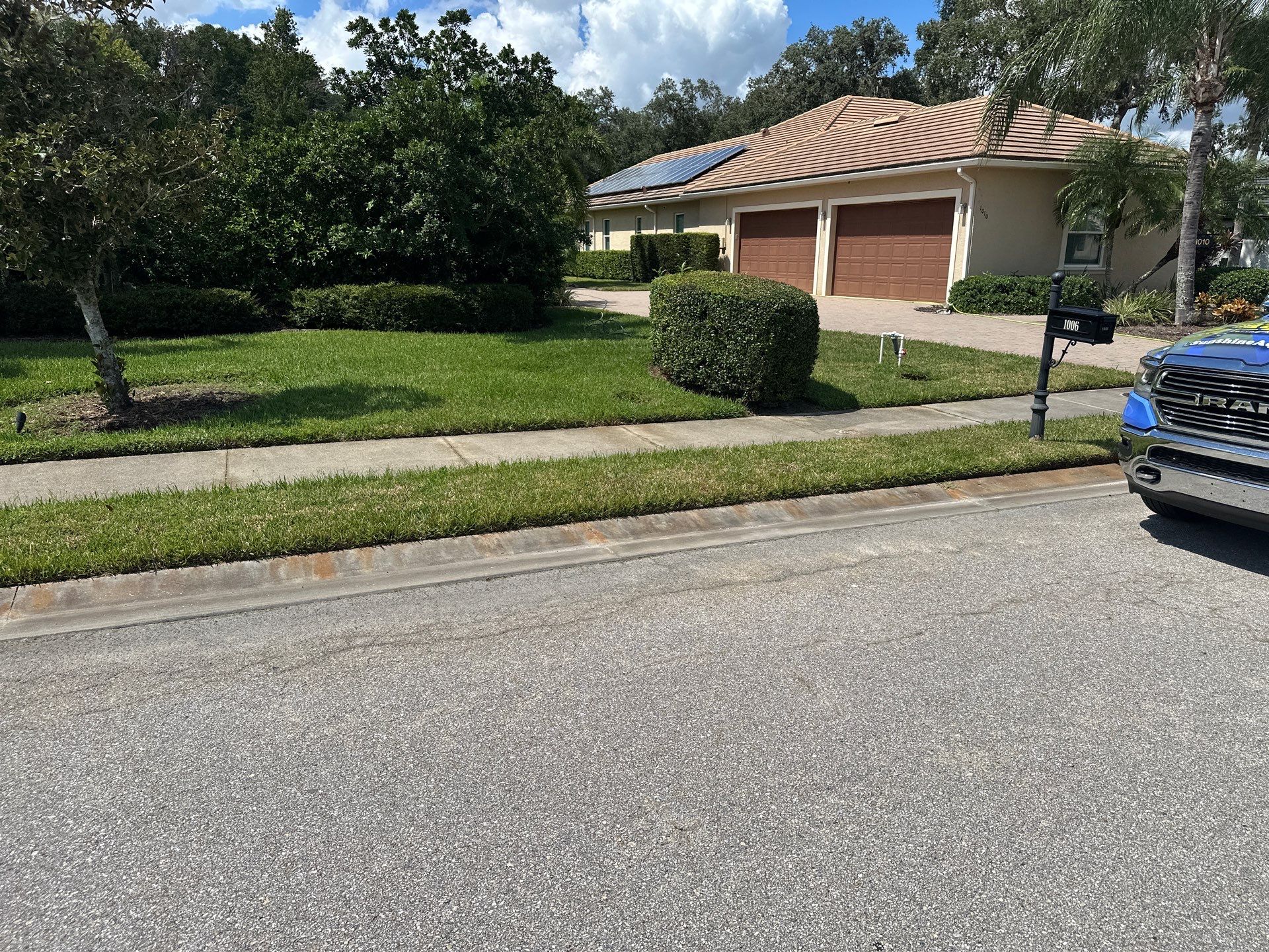 Paver Driveway, Entryway, Sidewalk, and Street Curbing Cleaning in Winding River Community, Bradenton, FL by Sunshine AquaWash