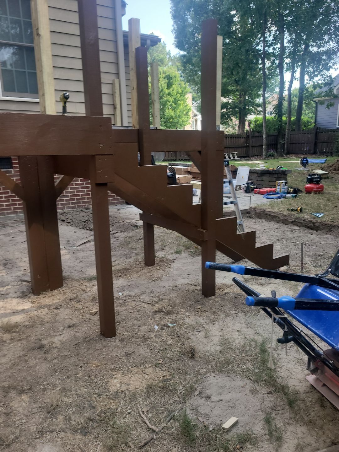 Fuquay-Varina Outdoor Upgrade – Composite Deck & Paved Landing by Elite Remodeling and Design LLC