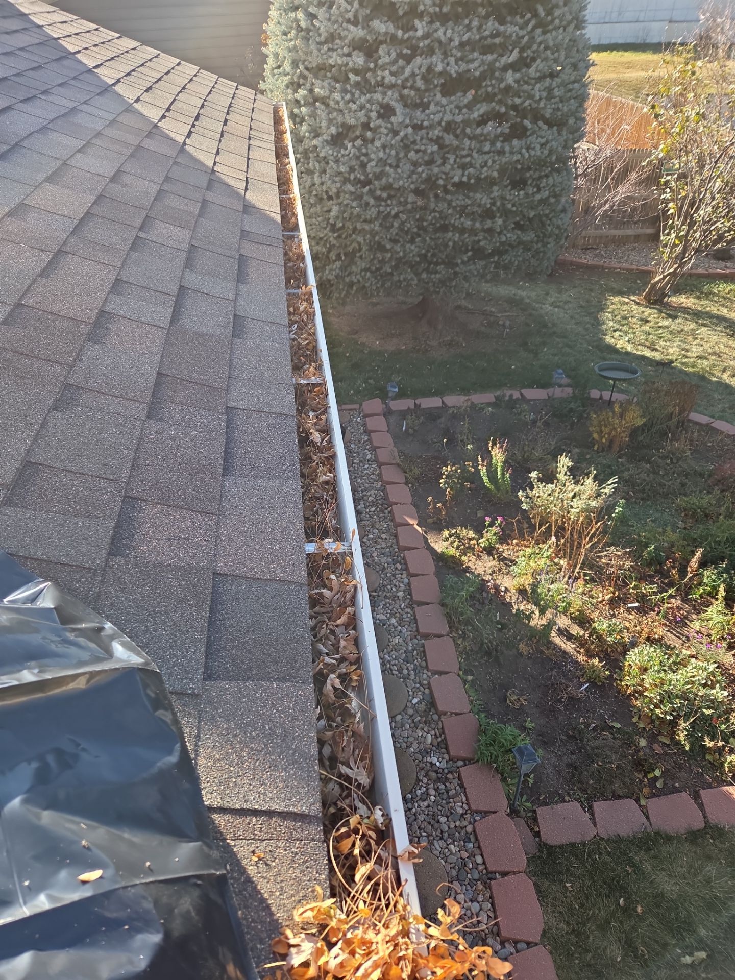Gutter and Downspout Cleaning by RTP Roofing Company
