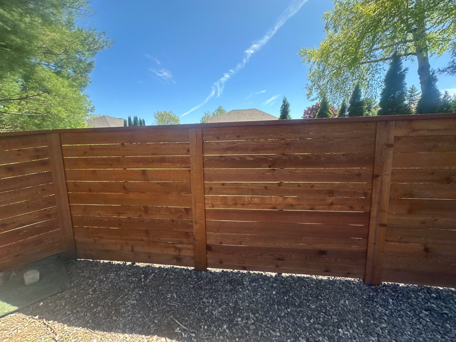 Horizontal Stained Wood Privacy Fence Installation in Waterloo by Perfect Picket Fence and Stain