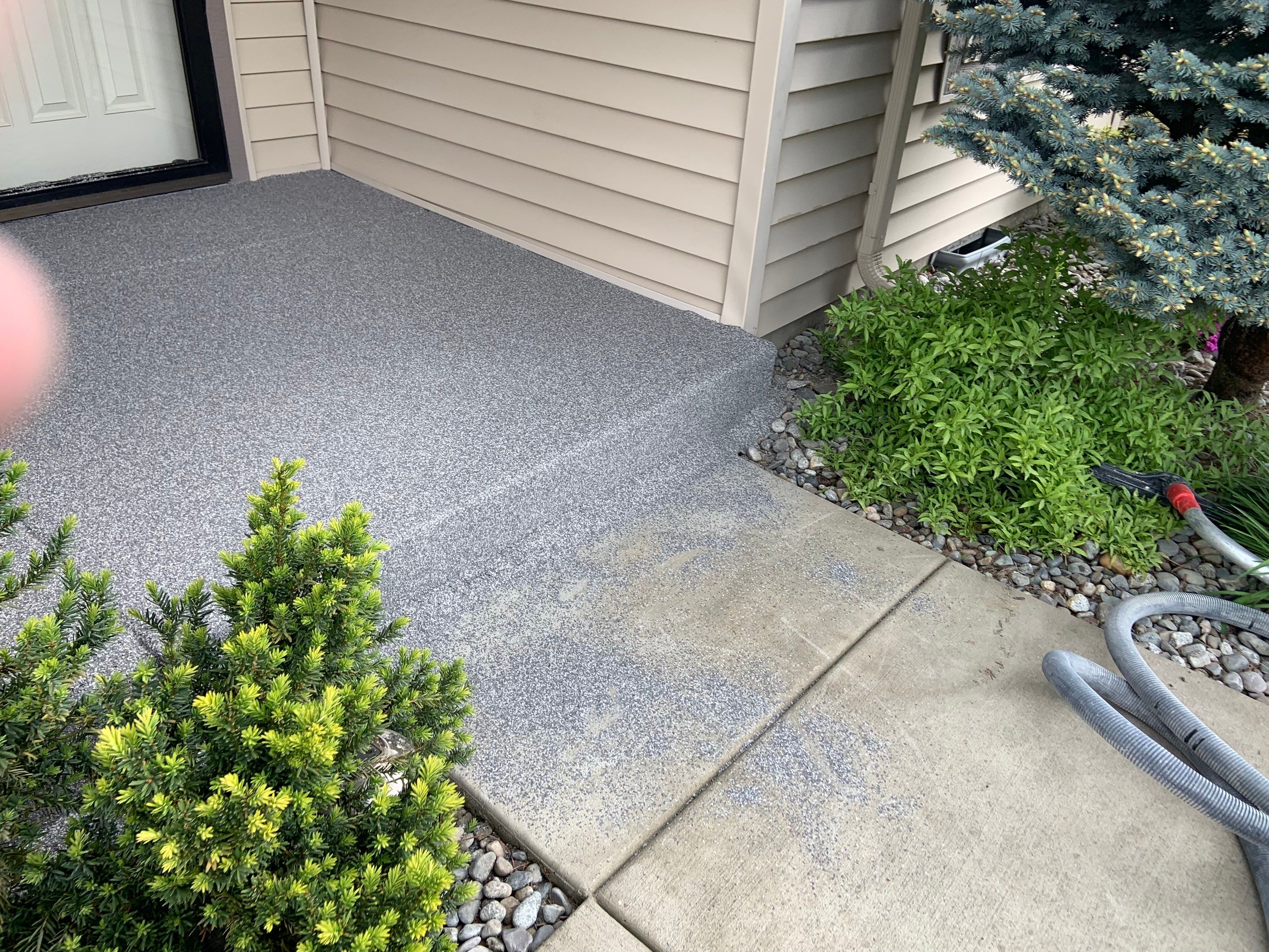 Garage Transformation using Pebble Beach and Front Porch using Greystone by Croc Coatings, LLC