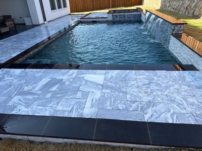 Modern Geometric Pool with Raised Spa and Marble Deck