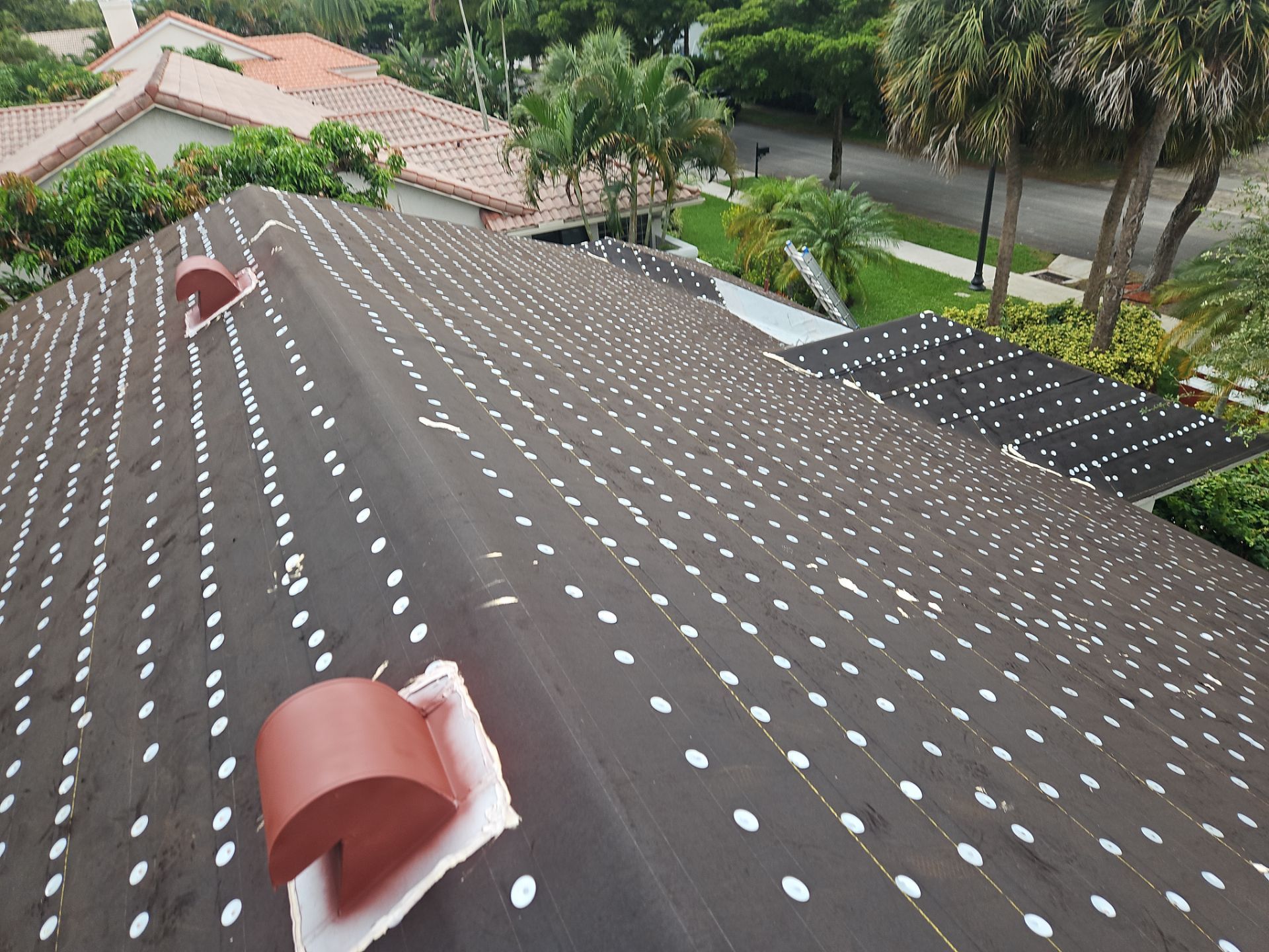 Residential Roofing Installation using 1" Nail strip metal roof by BLUES BROTHERS ROOFING