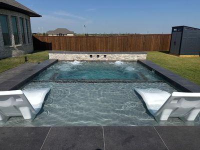 Modern Spool with Tanning Ledge and In-Water Loungers