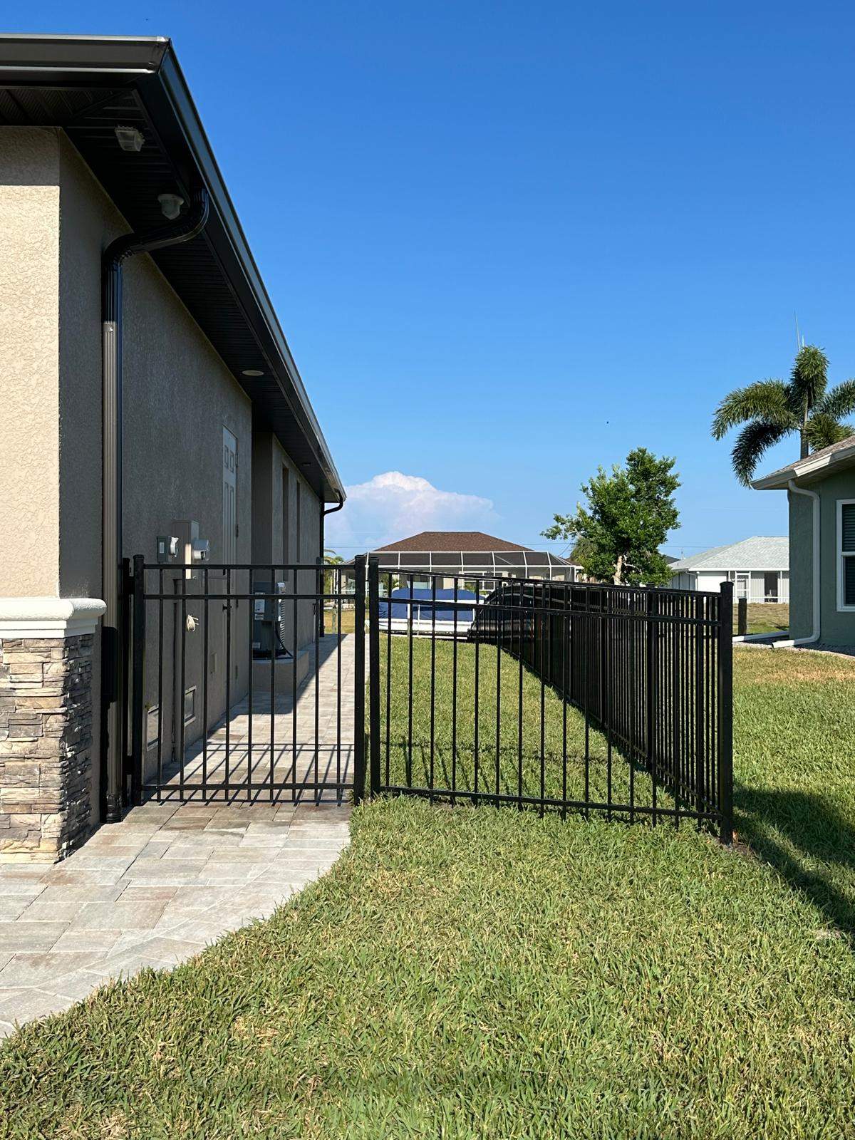 Waterfront Black Aluminum Fence Installation in Port Charlotte by True Fence LLC