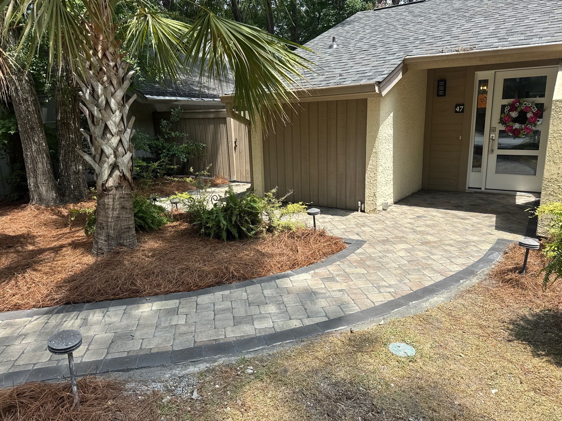 Custom Concrete Patio and Herringbone Paver Walkway in Hilton Head Island by Lowcountry Scapes, LLC