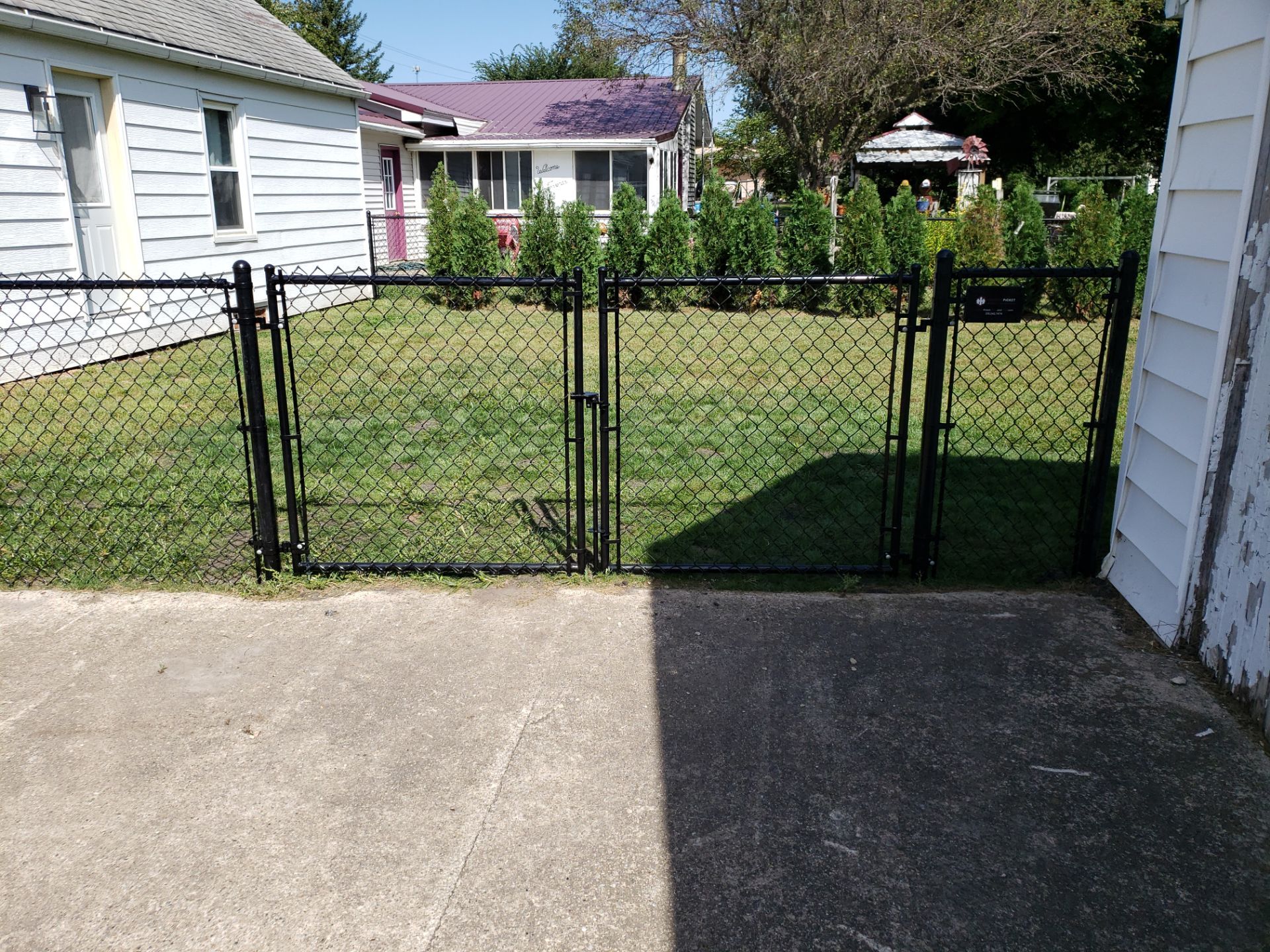 Residential Black Chain Link Fencing Project in Wellburg, Iowa by Perfect Picket Fence and Stain