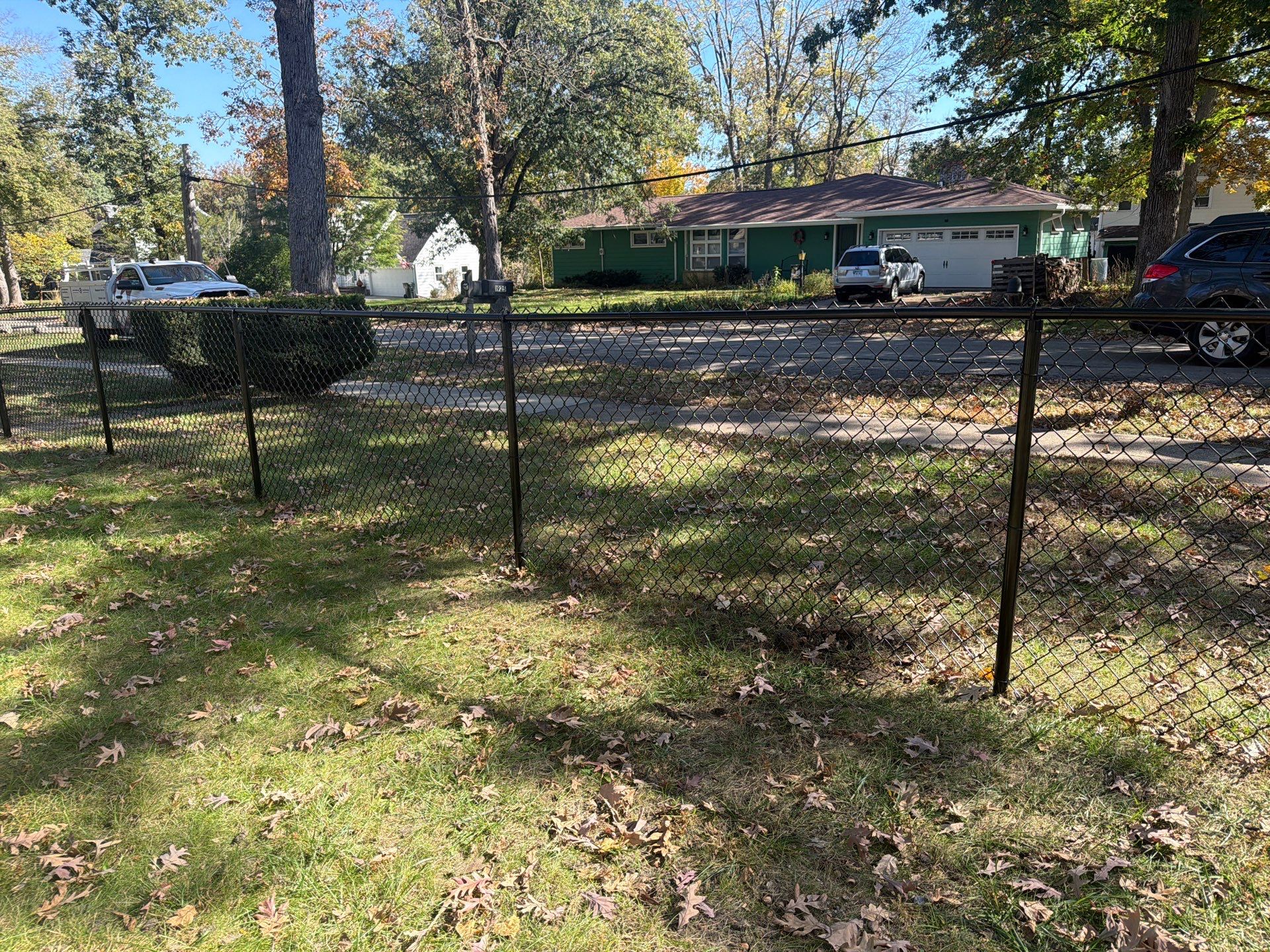 Residential Black Chain Link Fencing in Cedar Falls by Perfect Picket Fence and Stain