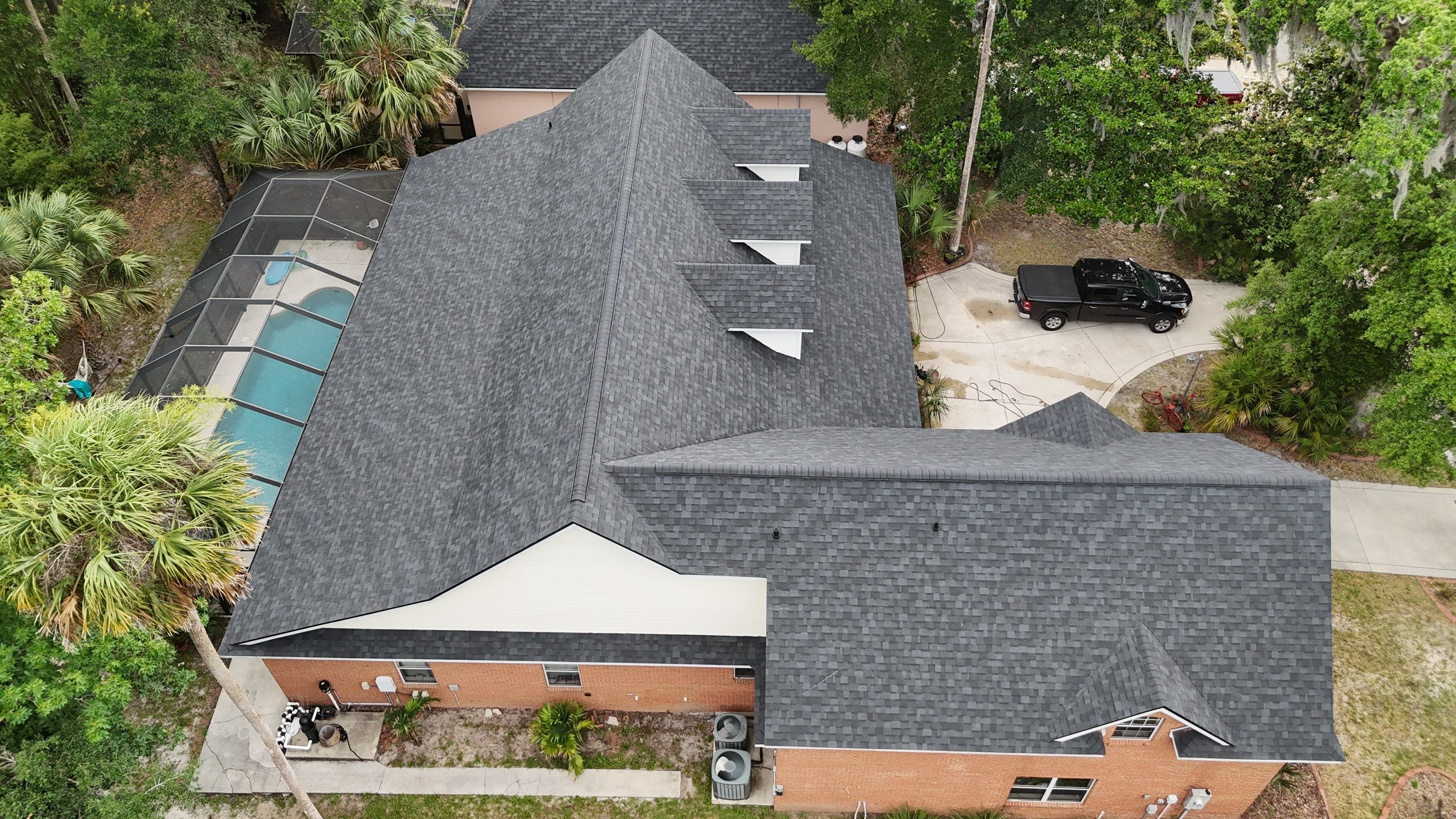 Comprehensive Onyx Black Asphalt Shingle Roof Replacement for Flagler Beach Residence by Trinity Restoration and Roofing LLC