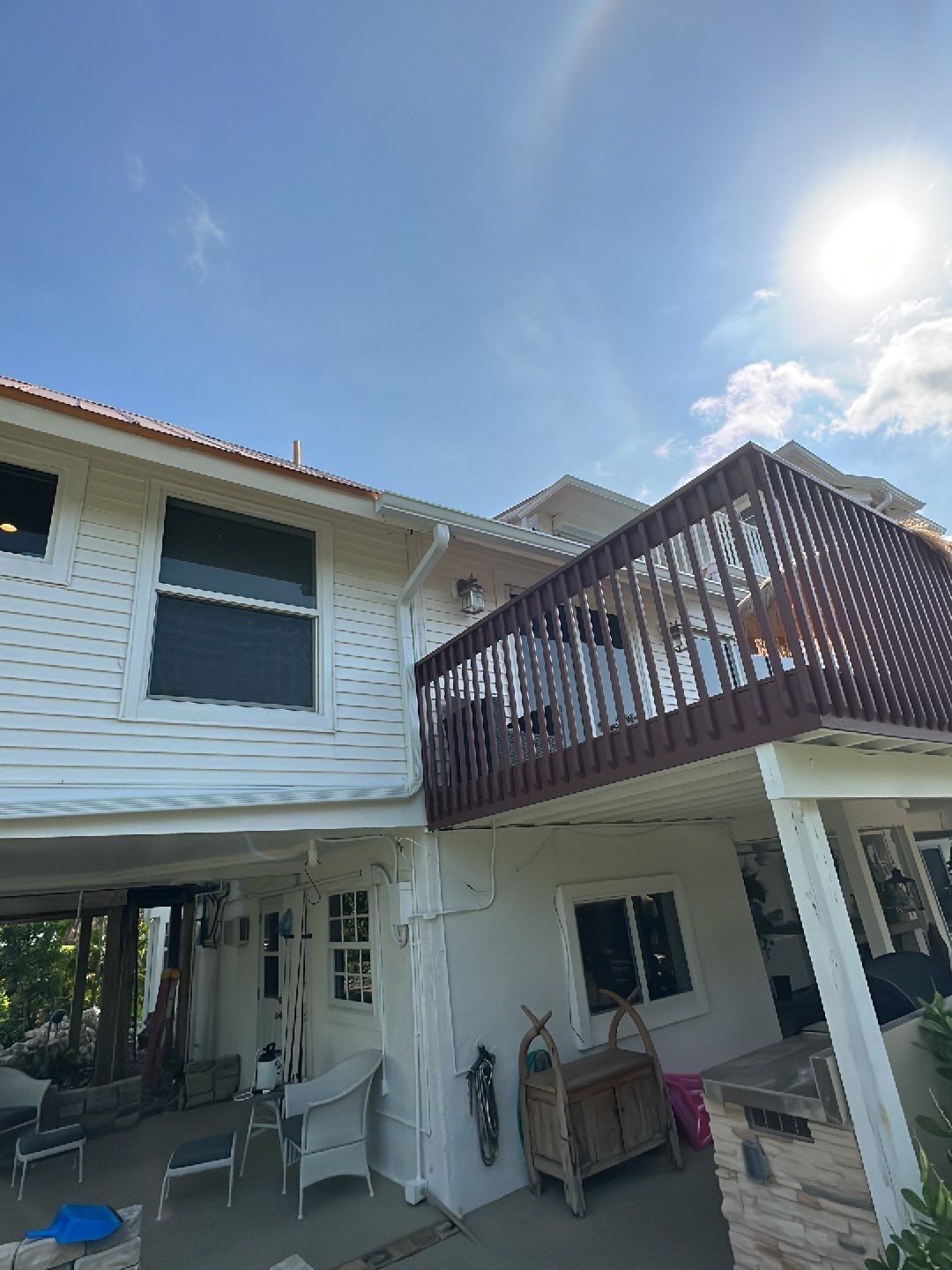 White K-Style Gutters Installed with White Downspouts in Sanibel FL by Gutter Professors