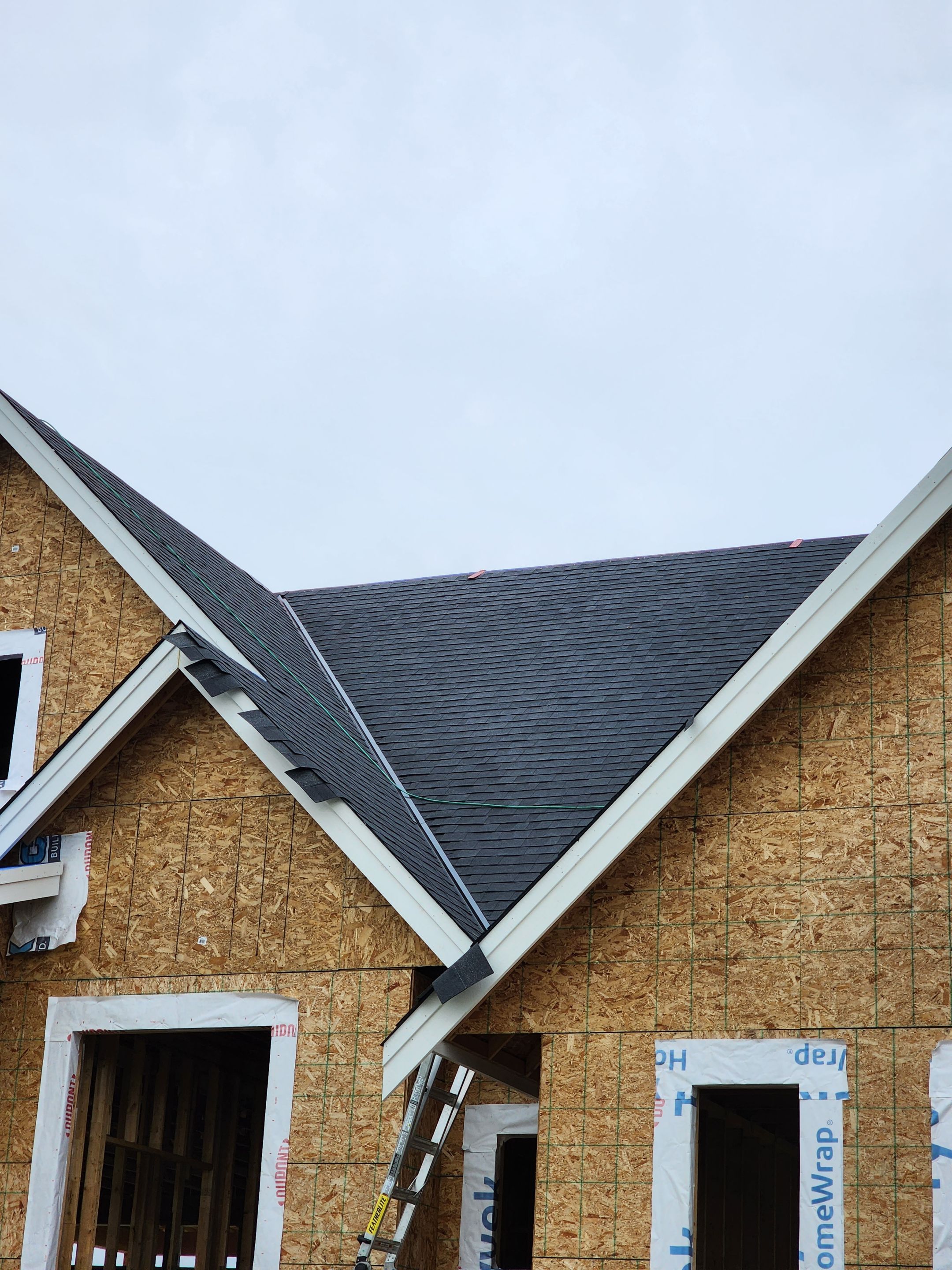 Residential Roofing Installation using OC Oakridge shingles by Top Notch Roofing Inc