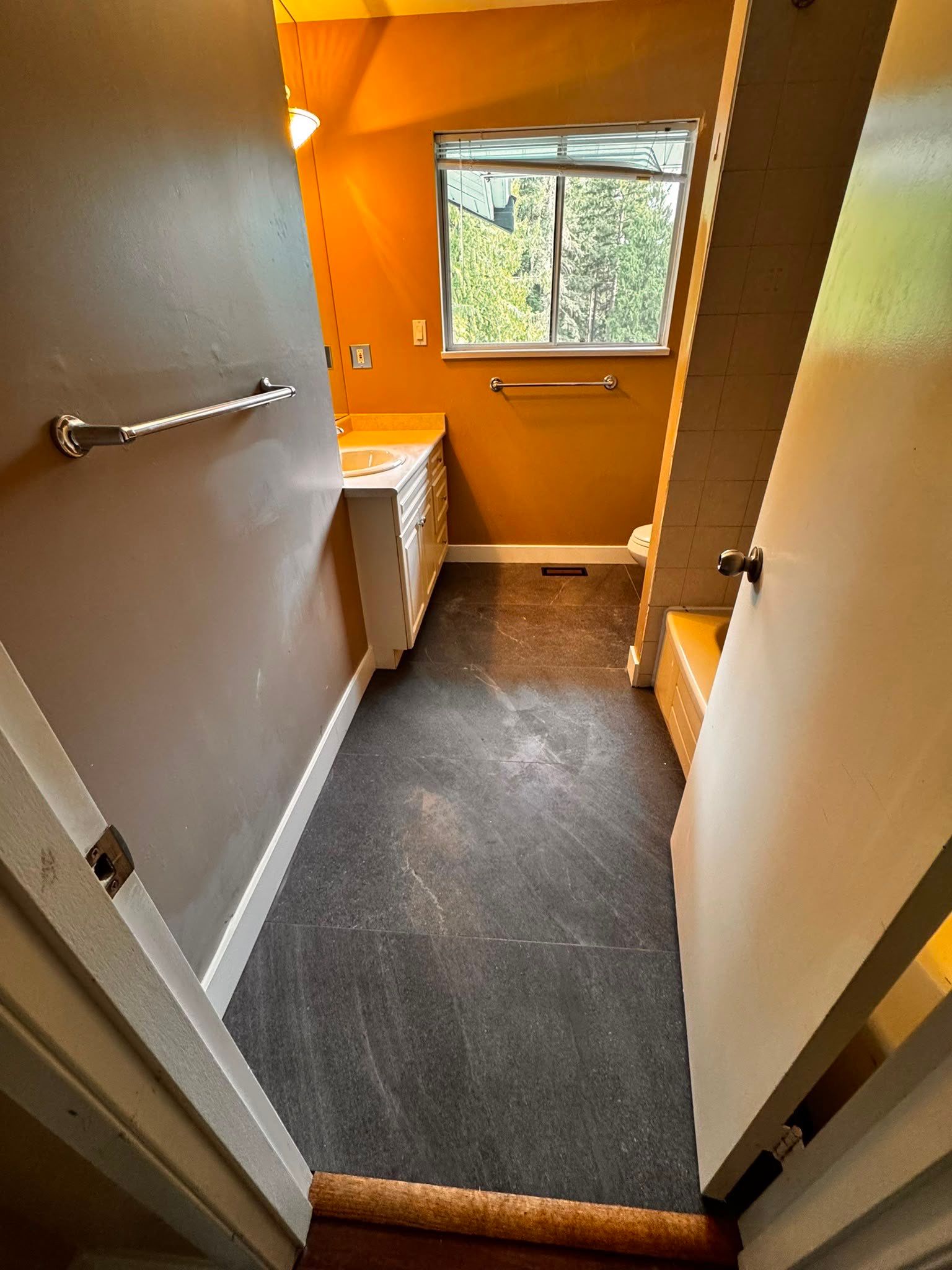 Bathroom Tile Floor Upgrade After Toilet Leak – West Vancouver Rental Property by YVR Construction Group