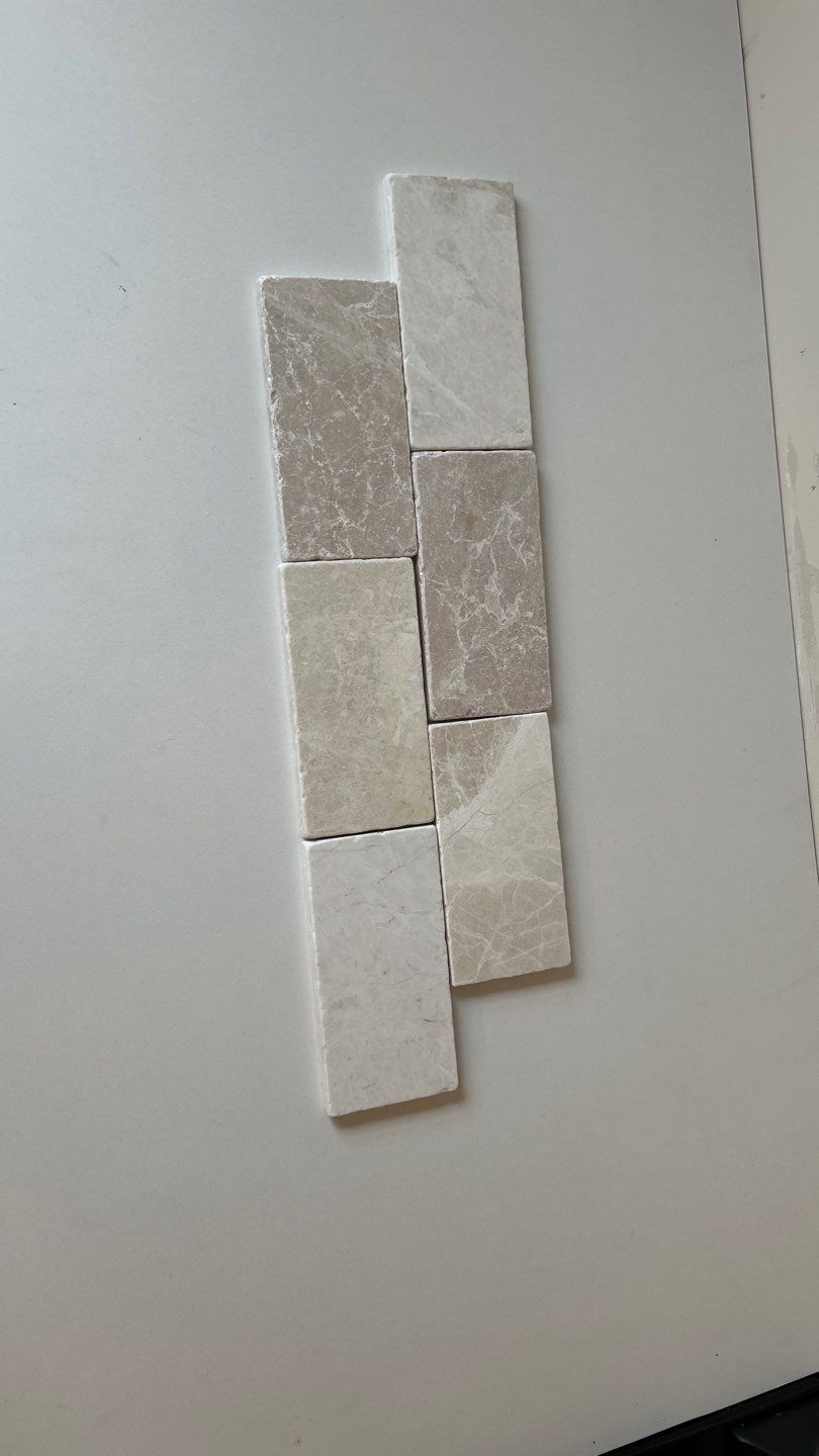 Lovely neutral backsplash  by Footprints Floors of Nashville