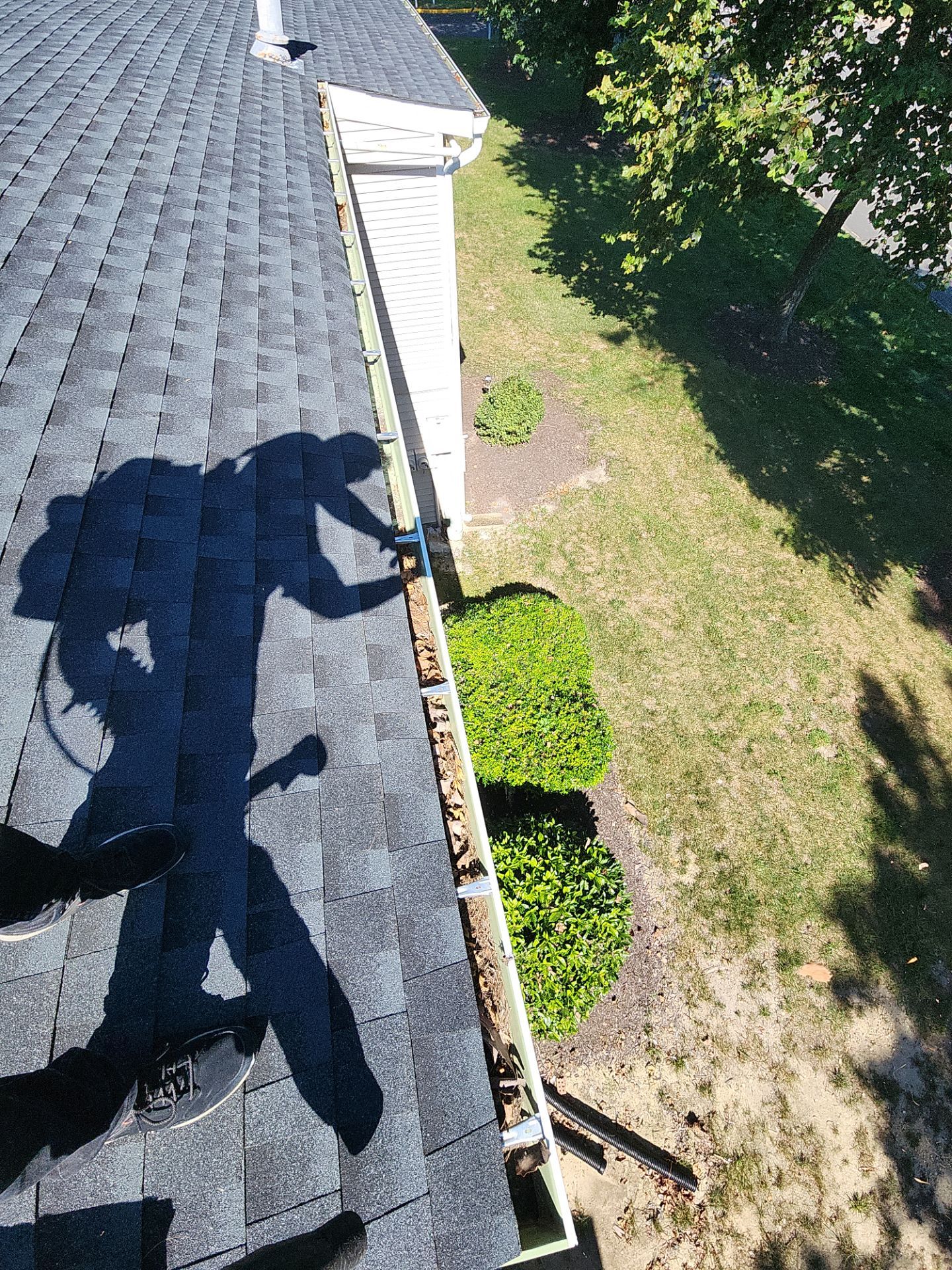 Commercial gutter cleaning Henrico before photo with filled gutters