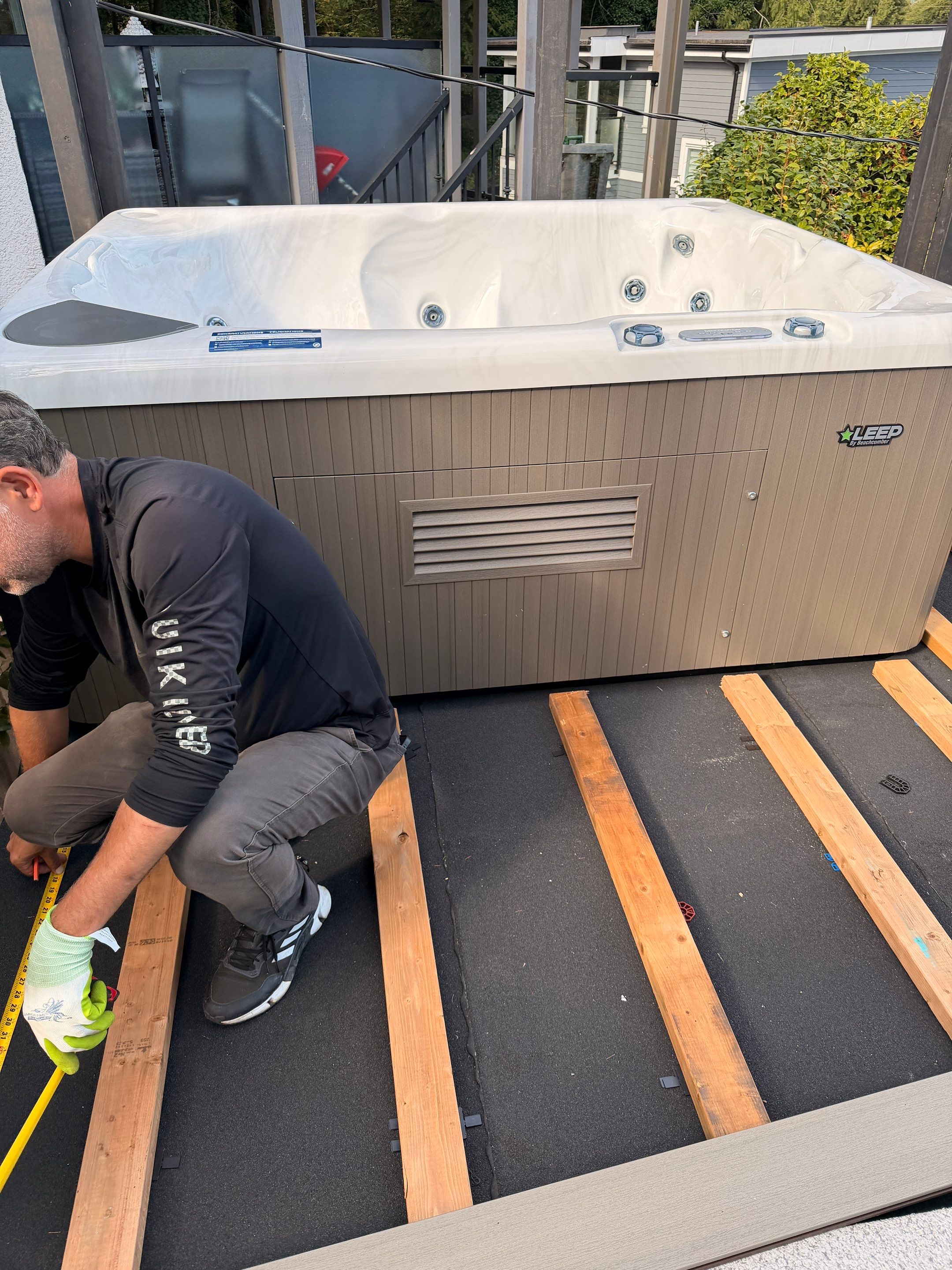 New Composite Deck with glass railing in North Vancouver by YVR Construction Group